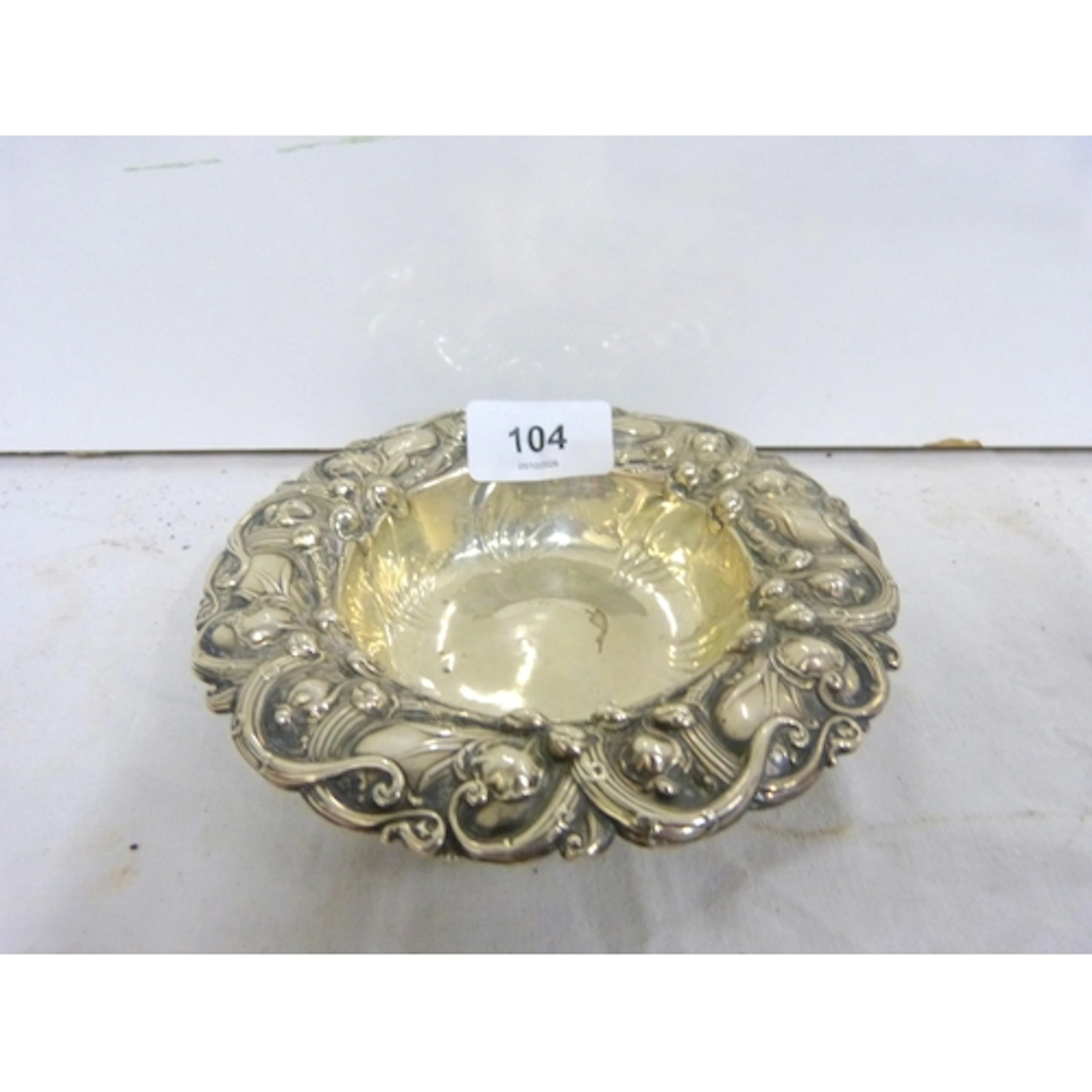 Silver repouse work bowl with Lily of the Valley pattern.