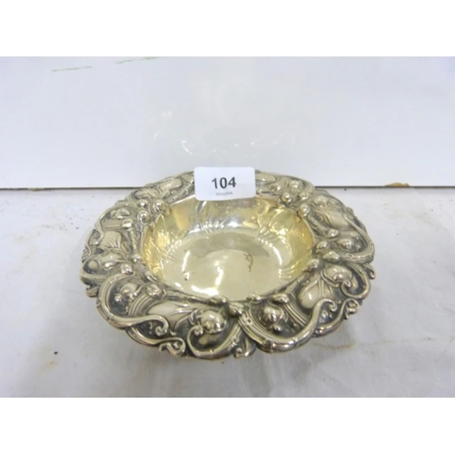 Silver repouse work bowl with Lily of the Valley pattern.
