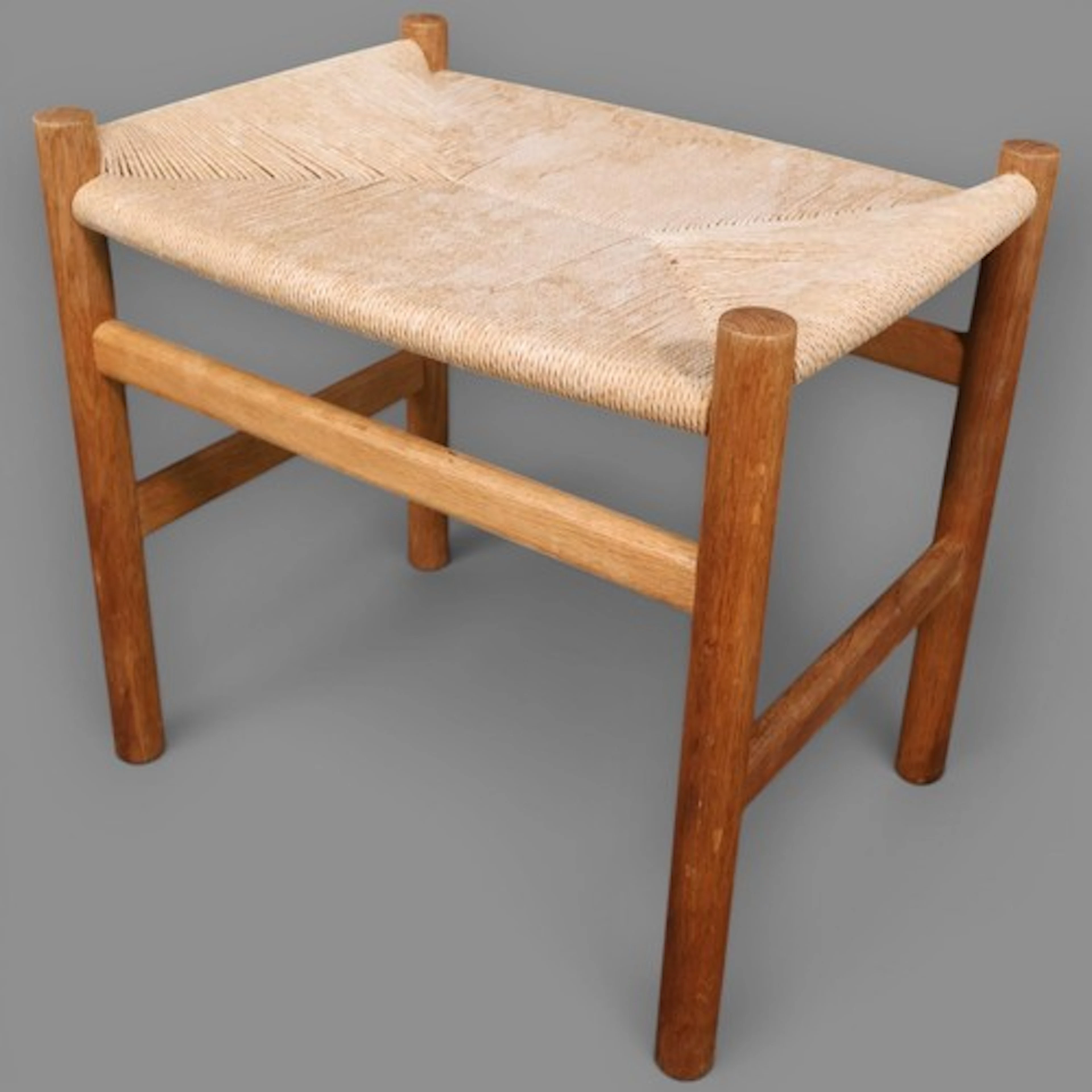 A mid-century design Carl Hansen oak and paper-cord stool, m...
