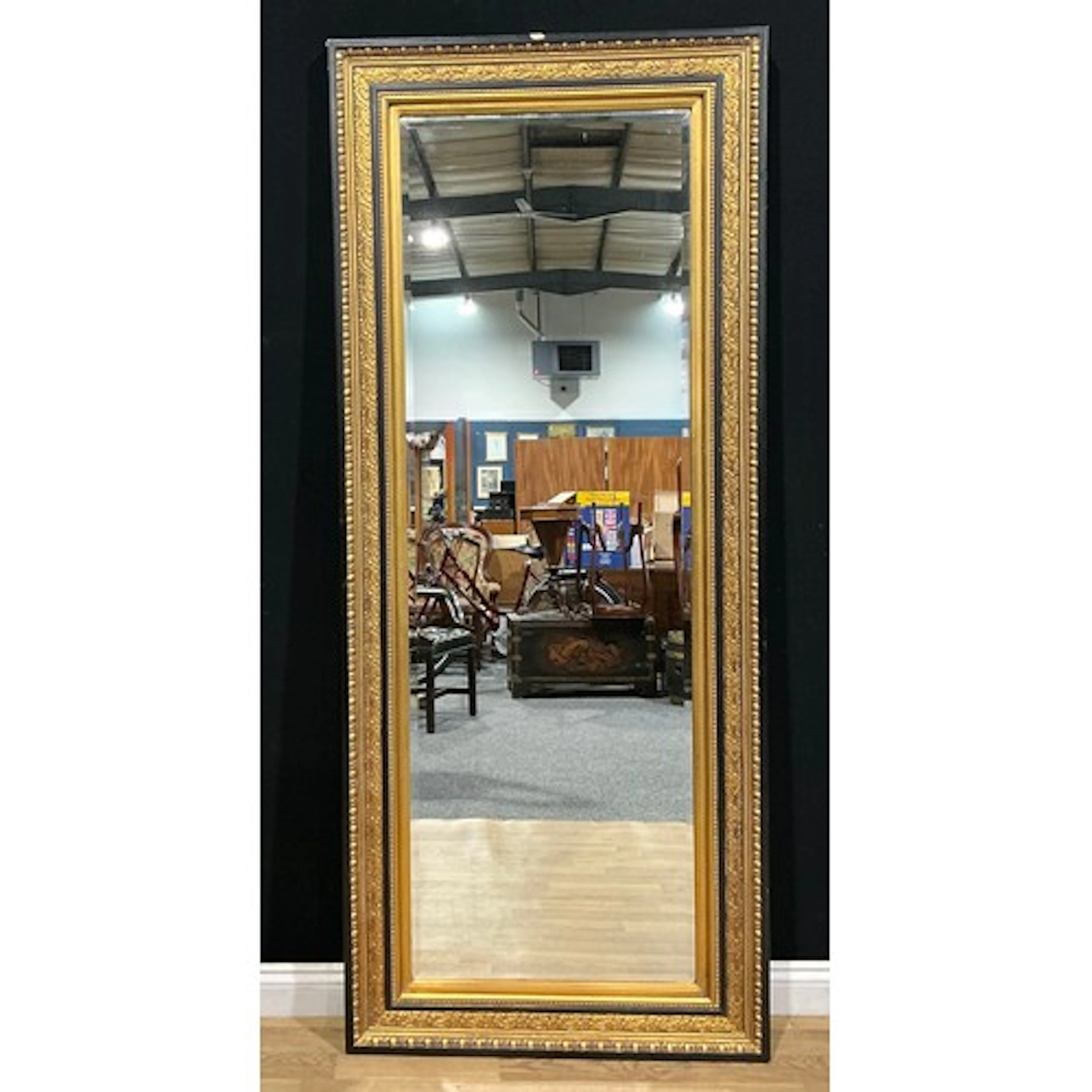 A large 19th century style looking glass, bevelled mirror pl...
