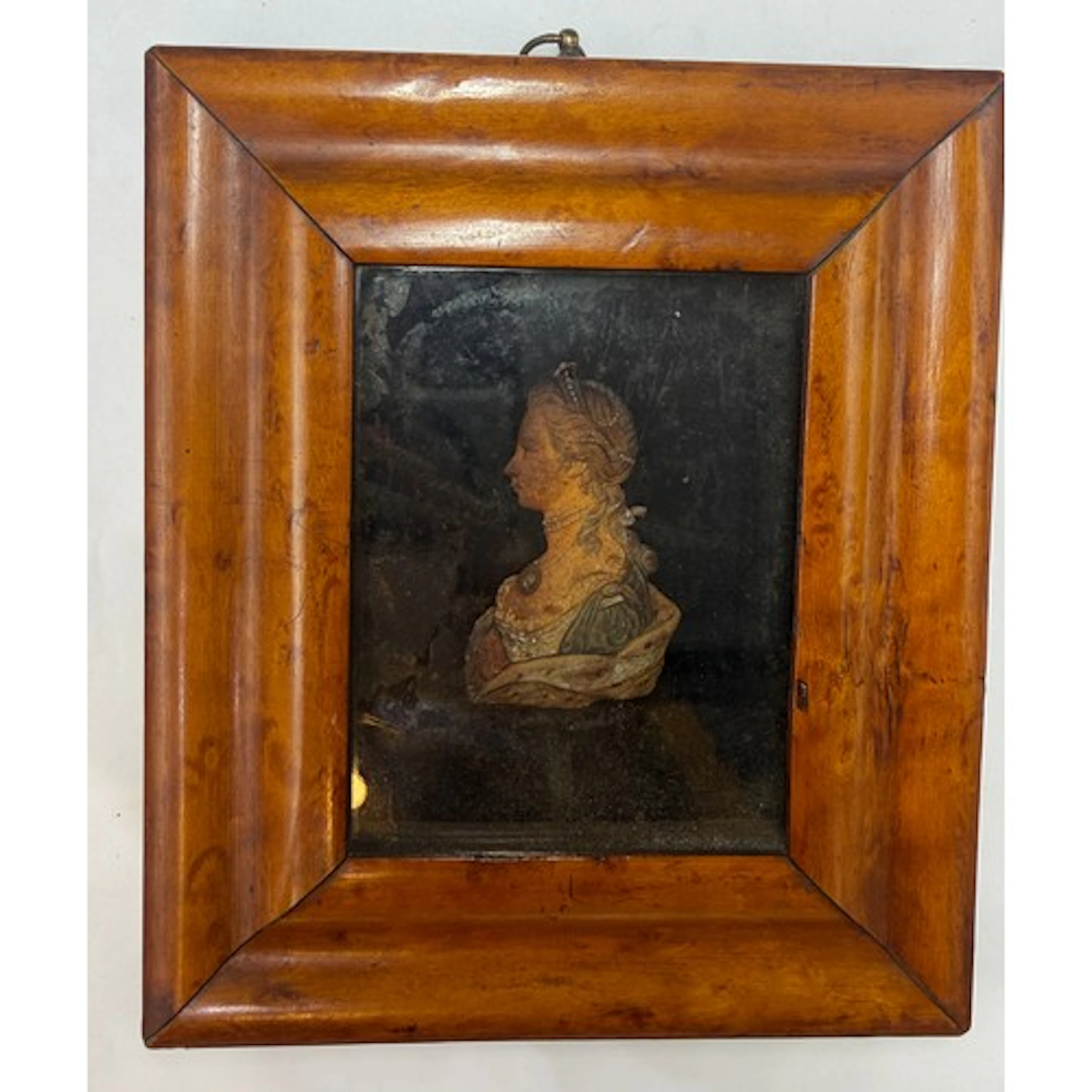 A wax miniature portrait of Queen Charlotte within a burr ma...