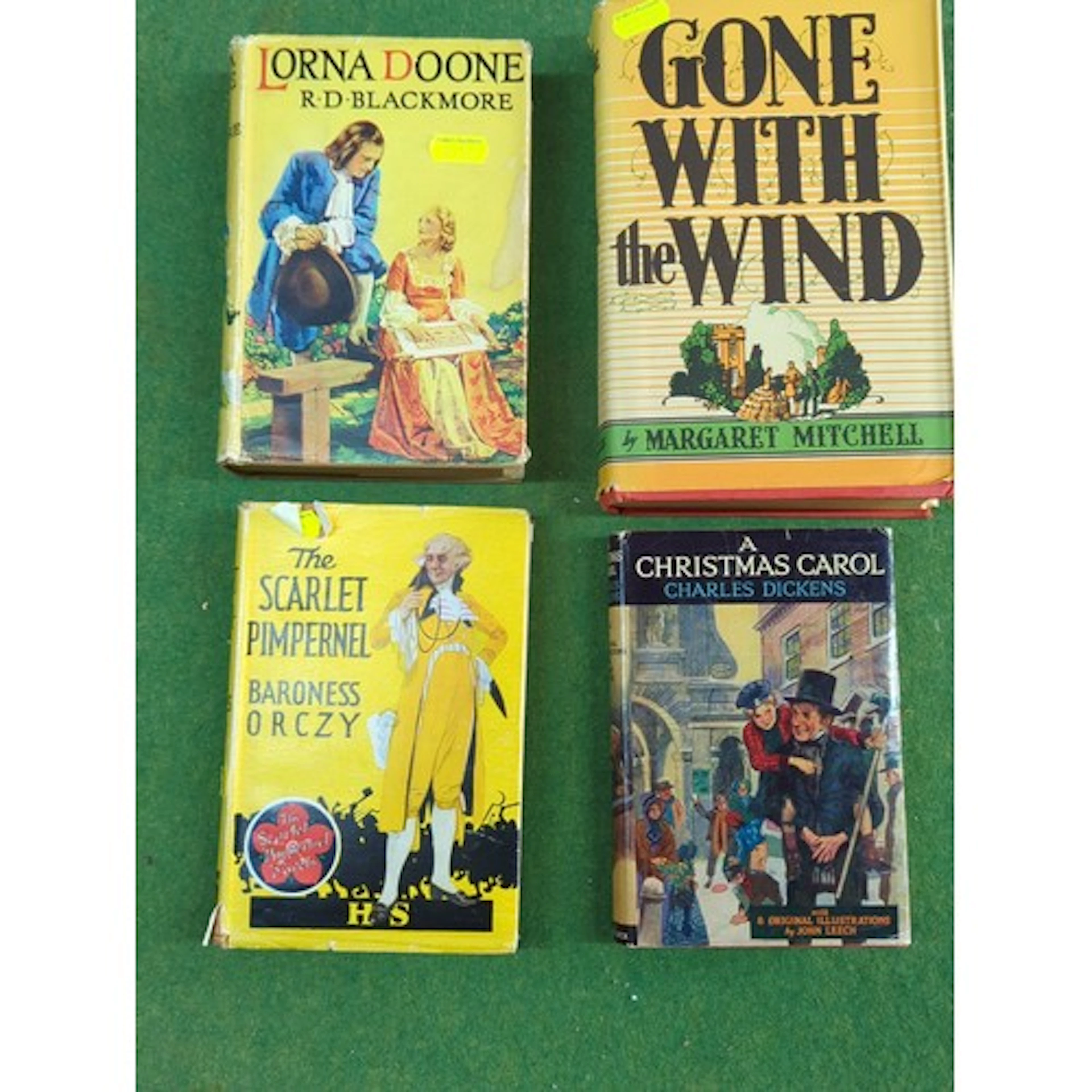 A group of four illustrated hardback novels: R.D. Blackmore,...