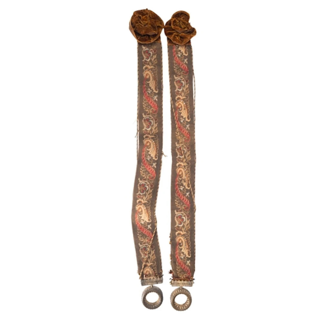 A pair of embroidered and gilt metal mounted bell-pulls, mid...
