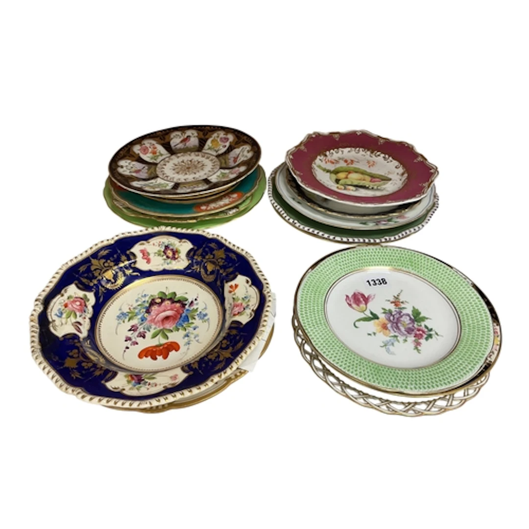 Seventeen English porcelain flower and fruit decorated plate...