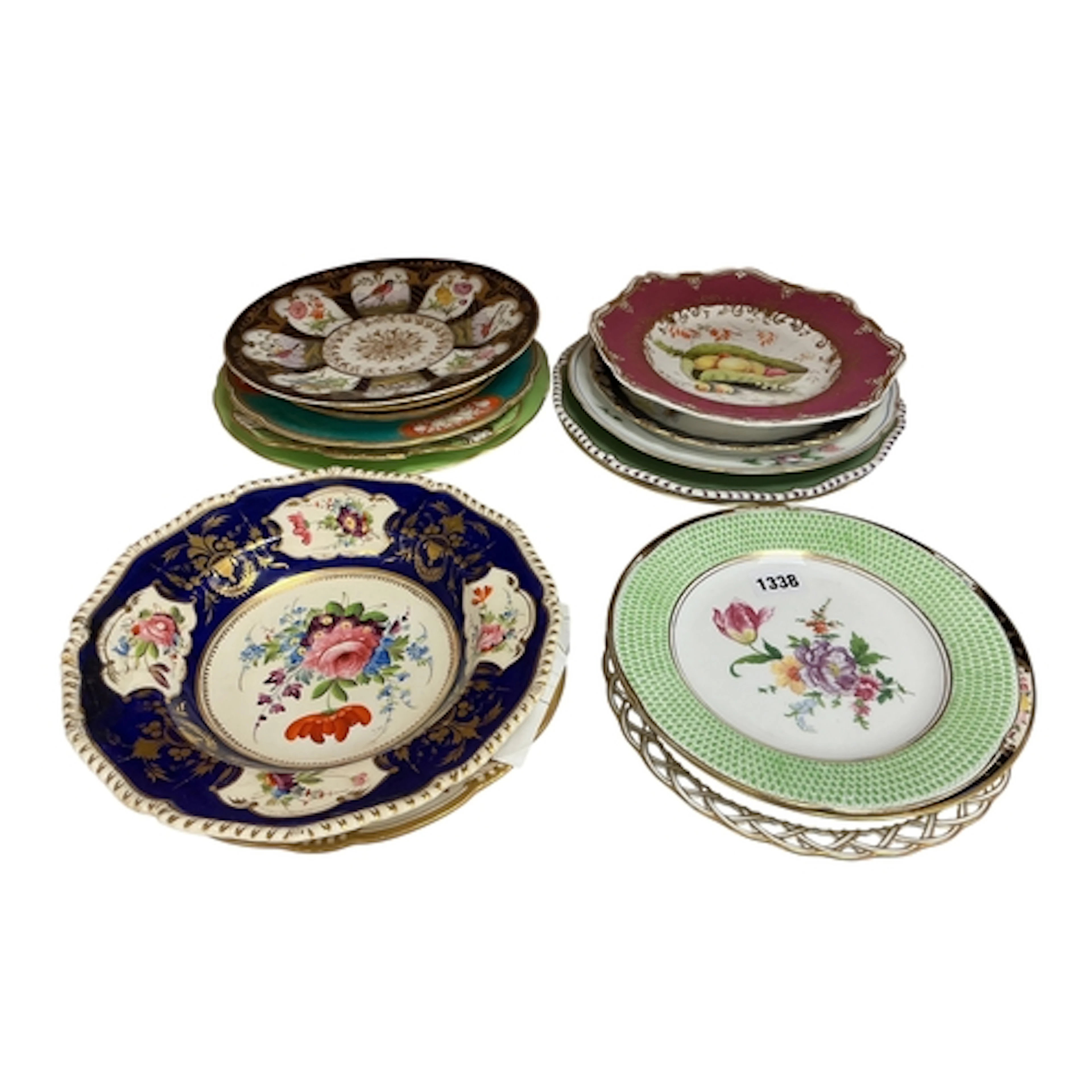 Seventeen English porcelain flower and fruit decorated plate...