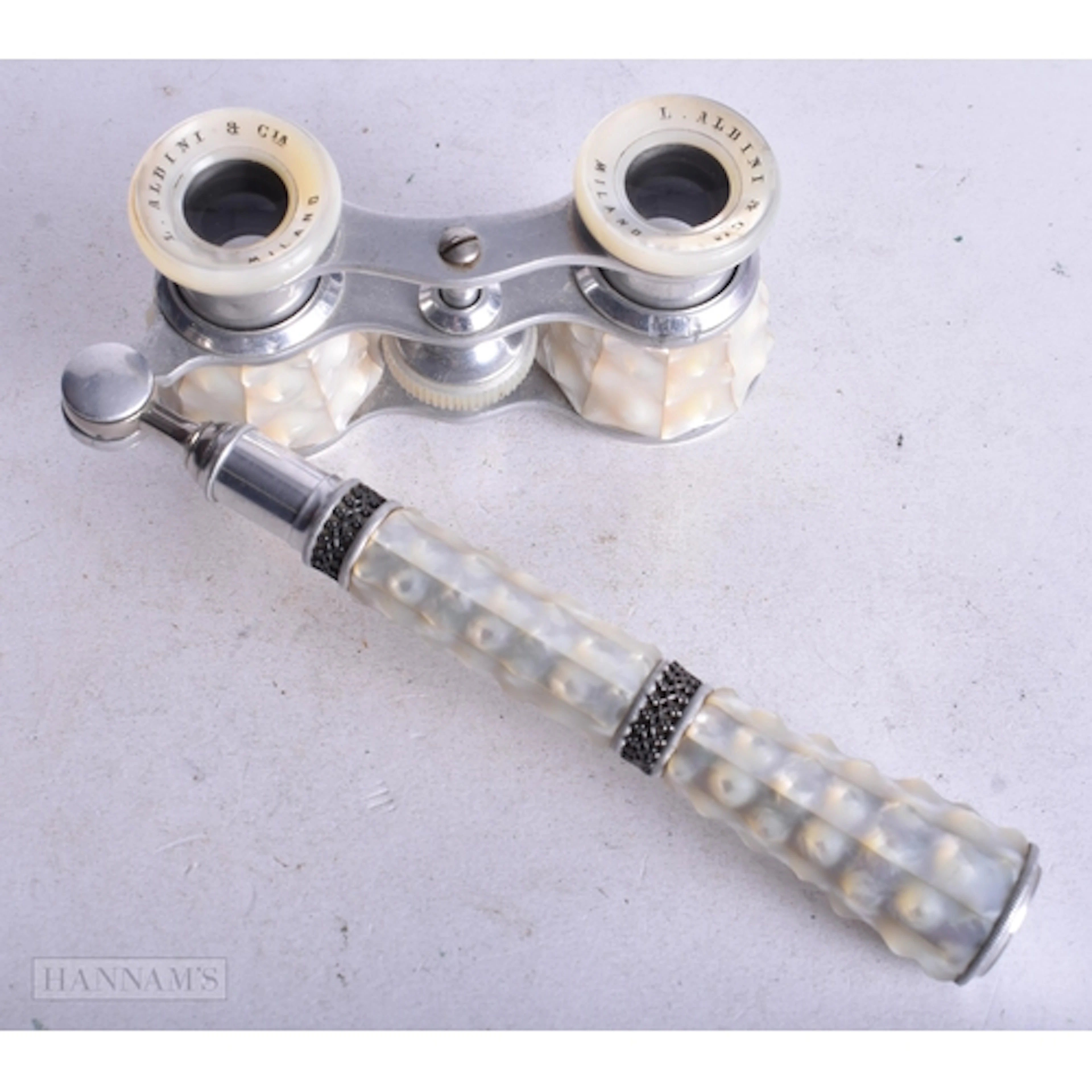 A Pair of Mother of Pearl Cased Opera Glasses with Handle by...