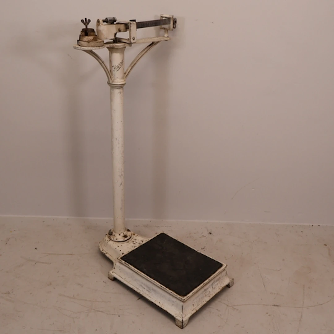 A vintage metal weighing scale, labelled Harrods. H95cm.