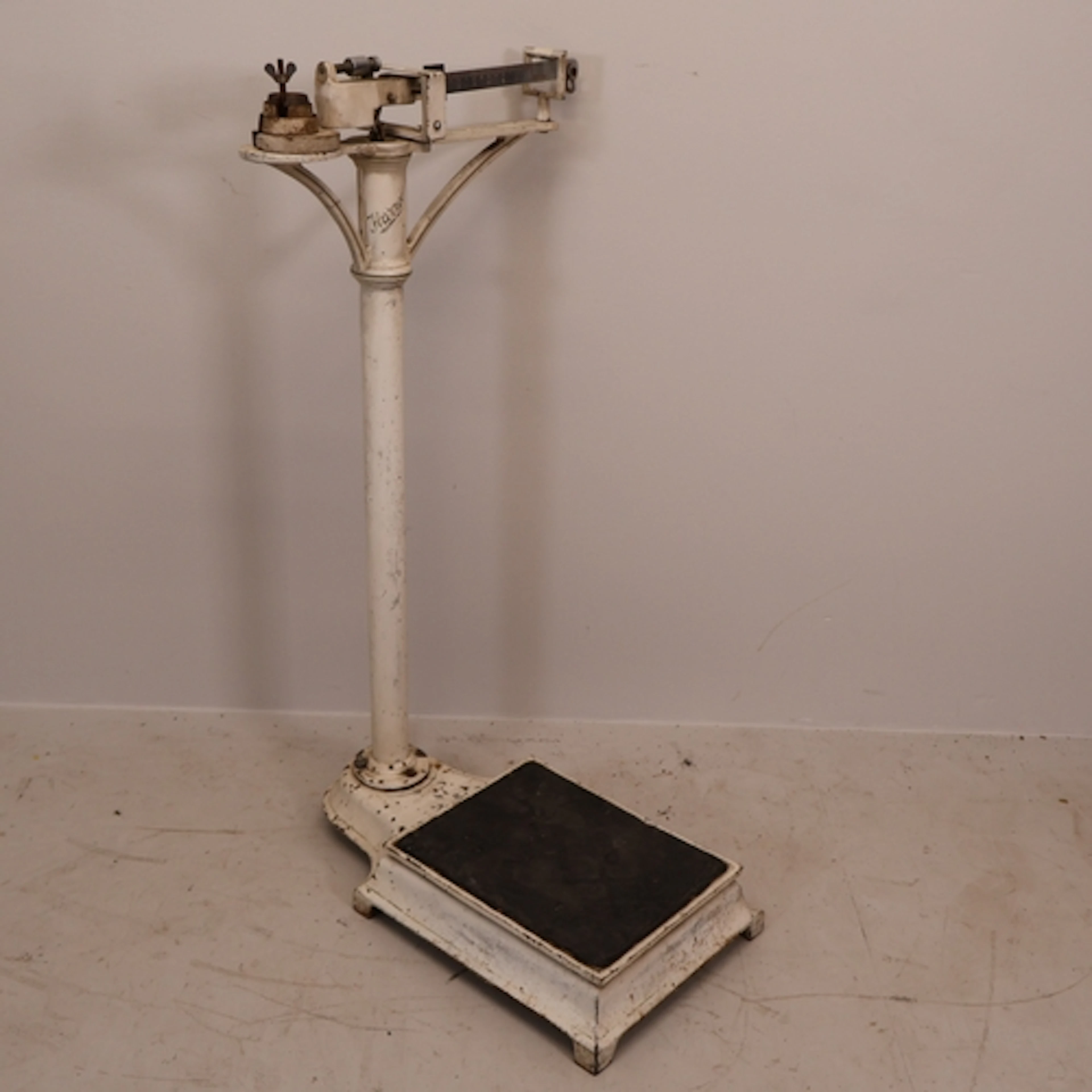 A vintage metal weighing scale, labelled Harrods. H95cm.