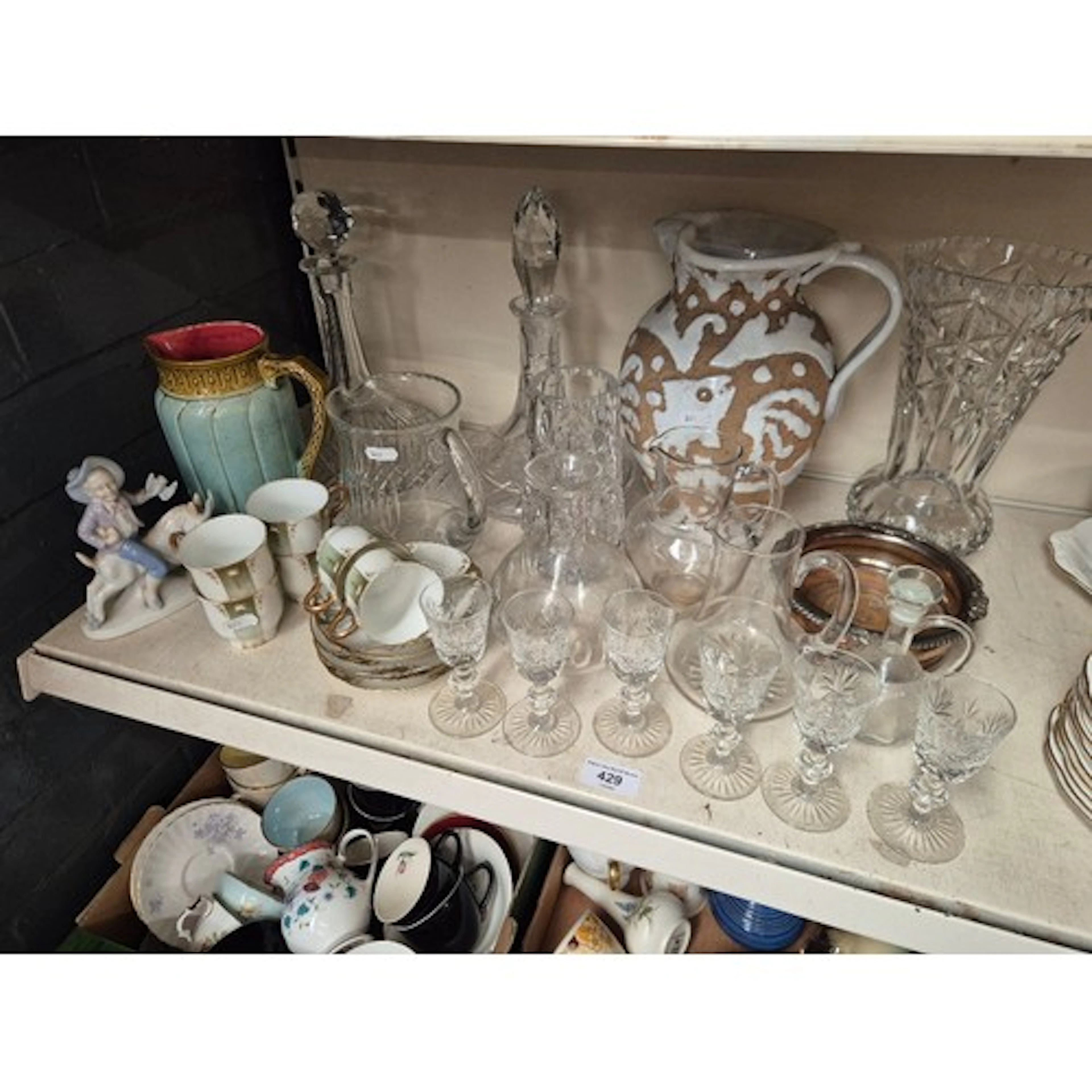 A collection of glass and ceramics to include 2 ships decant...