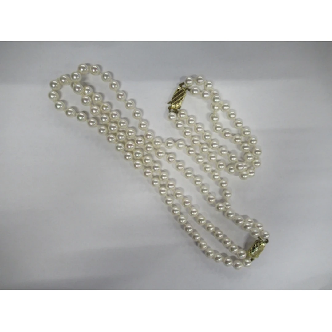 A pearl necklace and bracelet, both with 9ct gold clasps