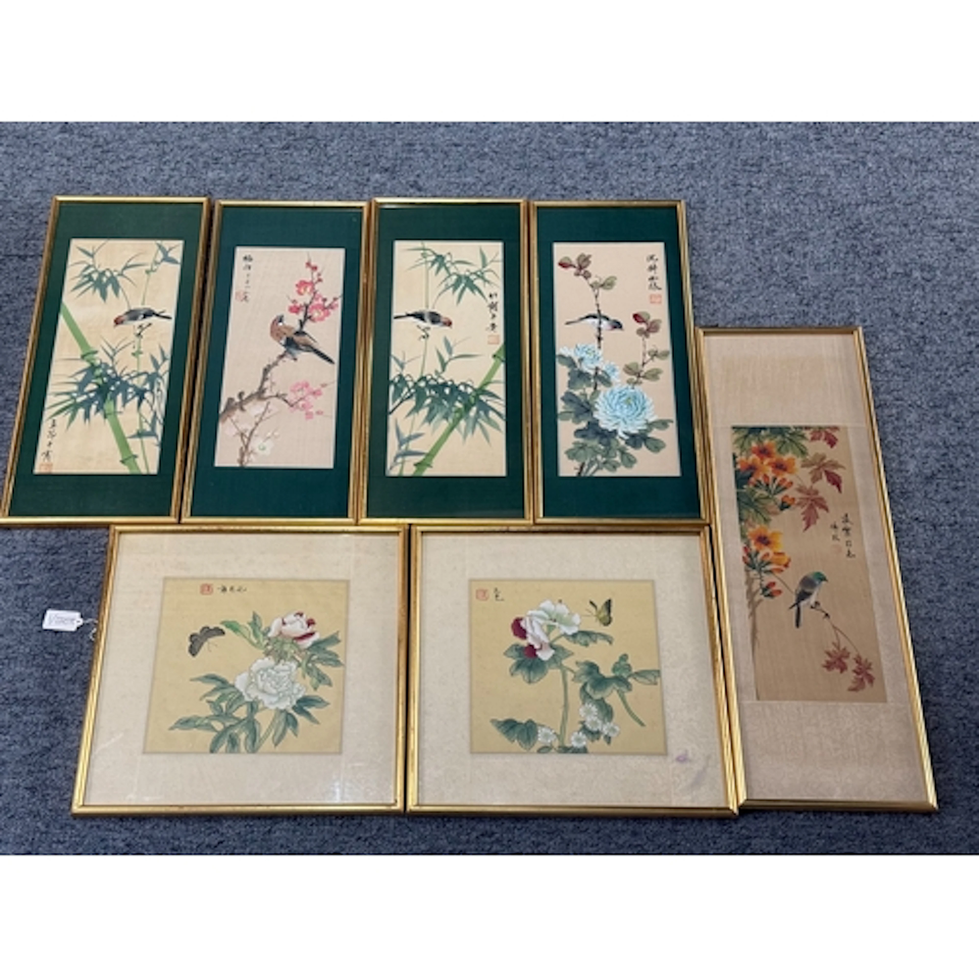 A set of four Japanese watercolours on silk of birds perched...