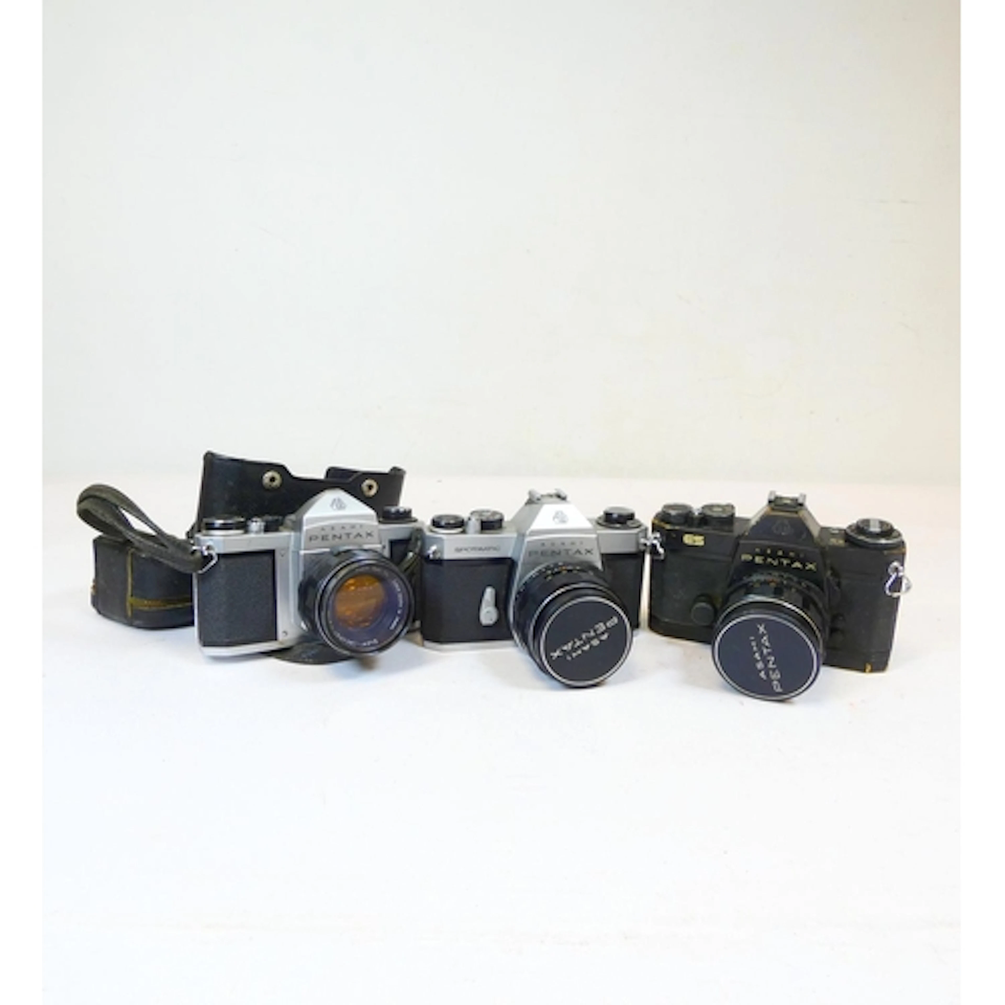 Asahi Pentax. Three vintage 35mm film cameras to include an ...