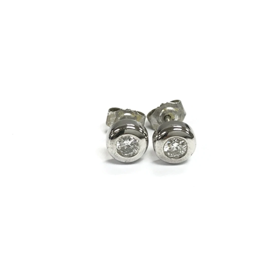 A pair of 18ct white gold diamond stud earrings. 2.61g