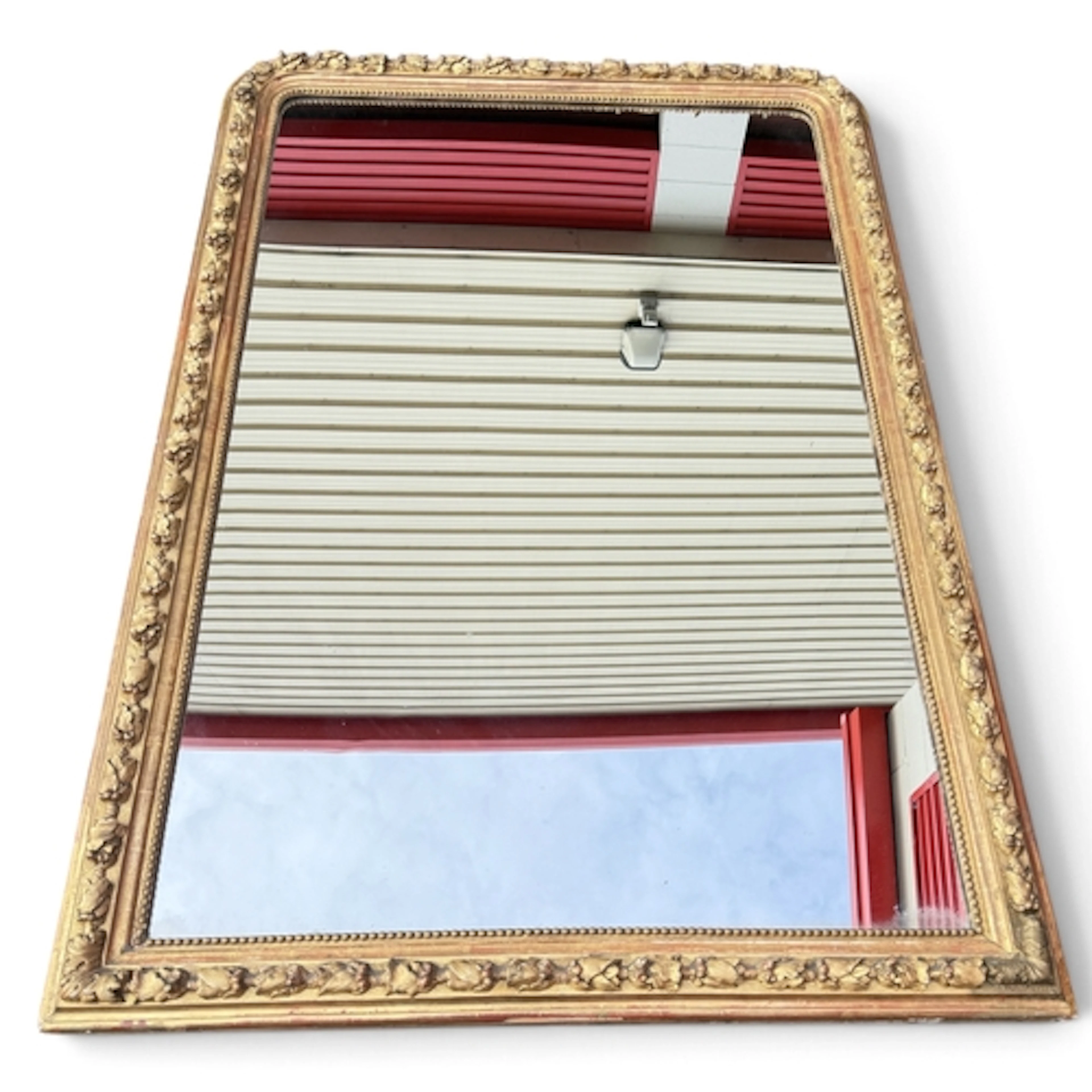 A LARGE ITALIAN GILT WOOD OVERMANTLE WALL MIRROR The arched ...