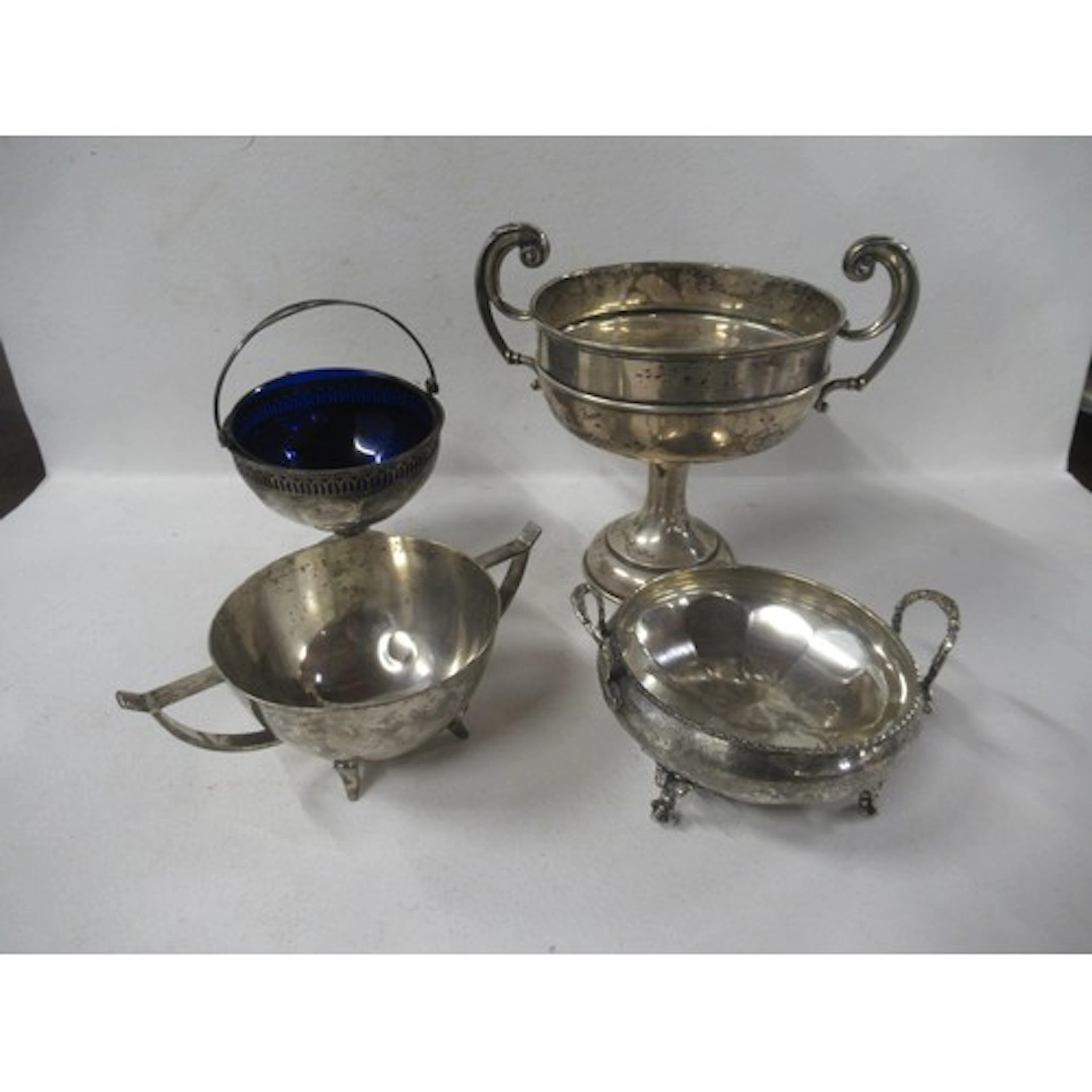 A silver two handled trophy cup, together with a silver pede...