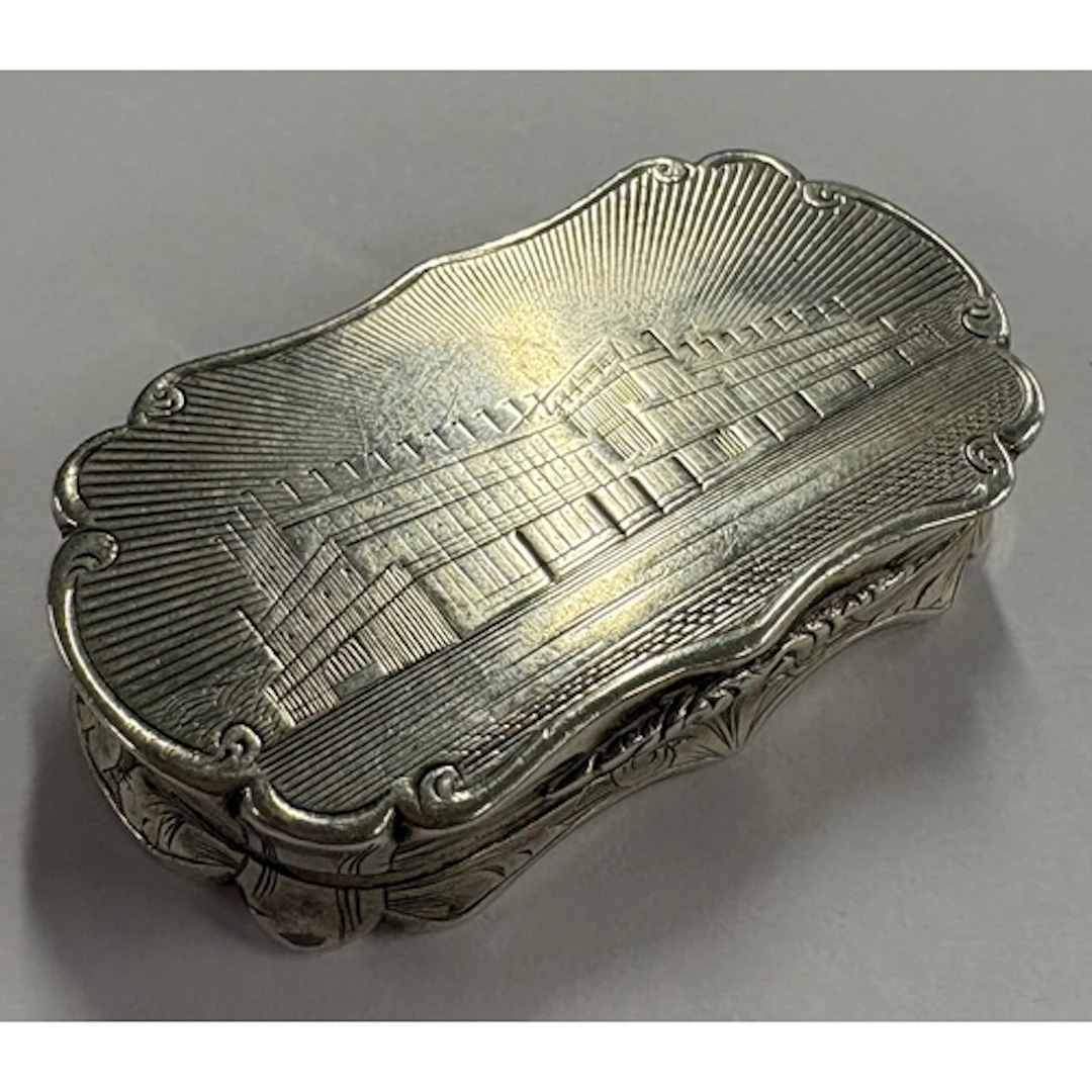 An engraved silver castle top vinaigrette depicting Crystal ...