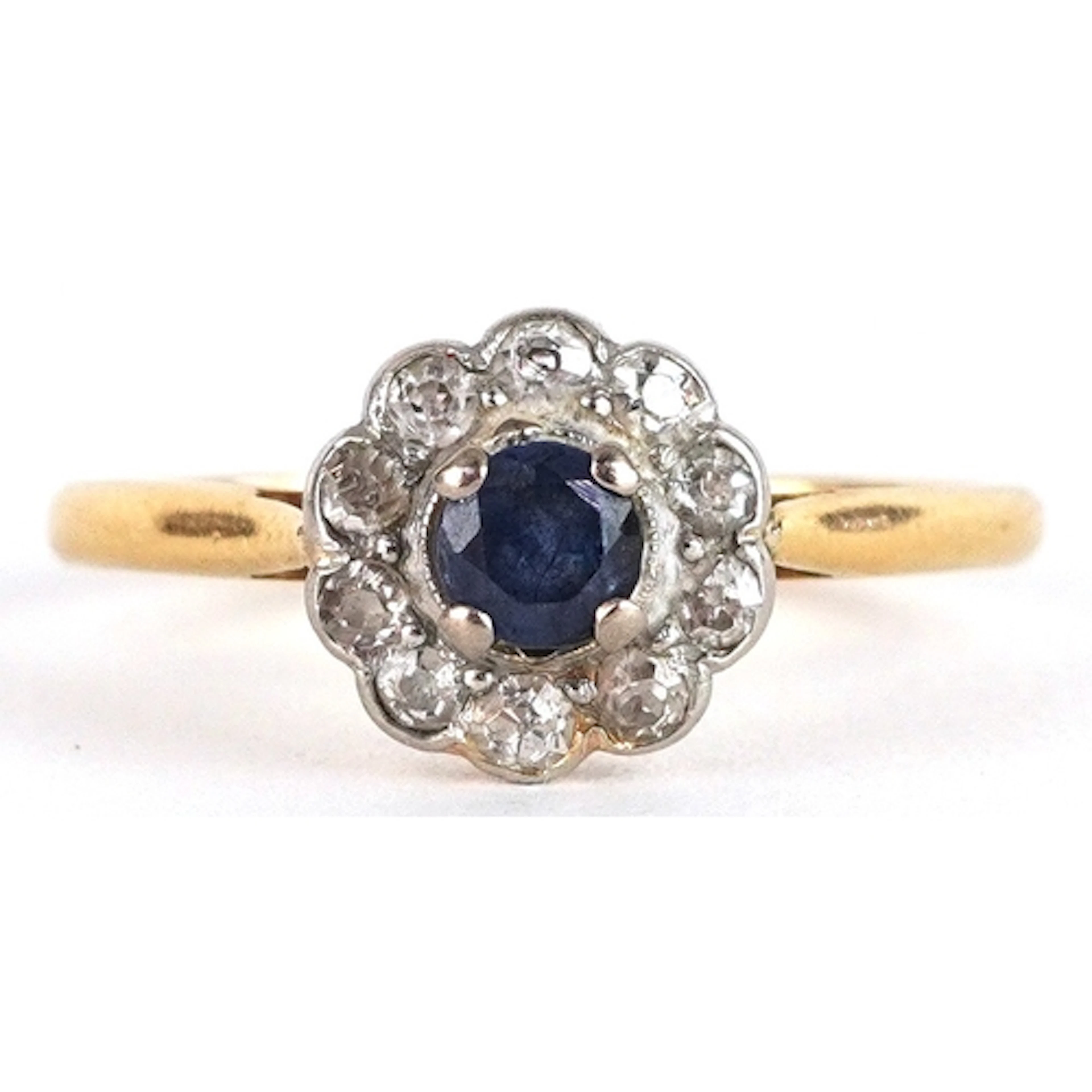 Unmarked high carat gold sapphire and diamond flower head ri...