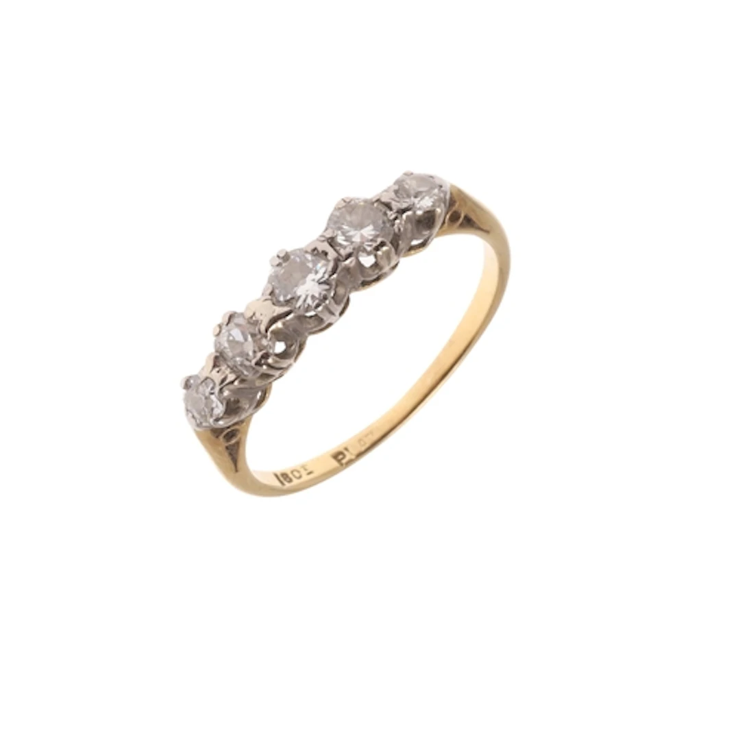 A DIAMOND FIVE STONE RING. mounted with five graduated circu...