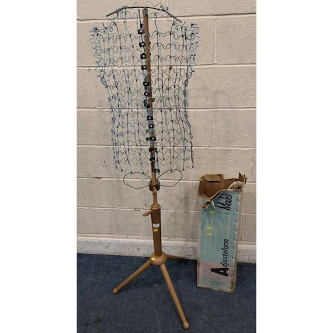 AN ADJUSTFORM DRESSMAKING MODEL MANNEQUIN, with a wire body,...