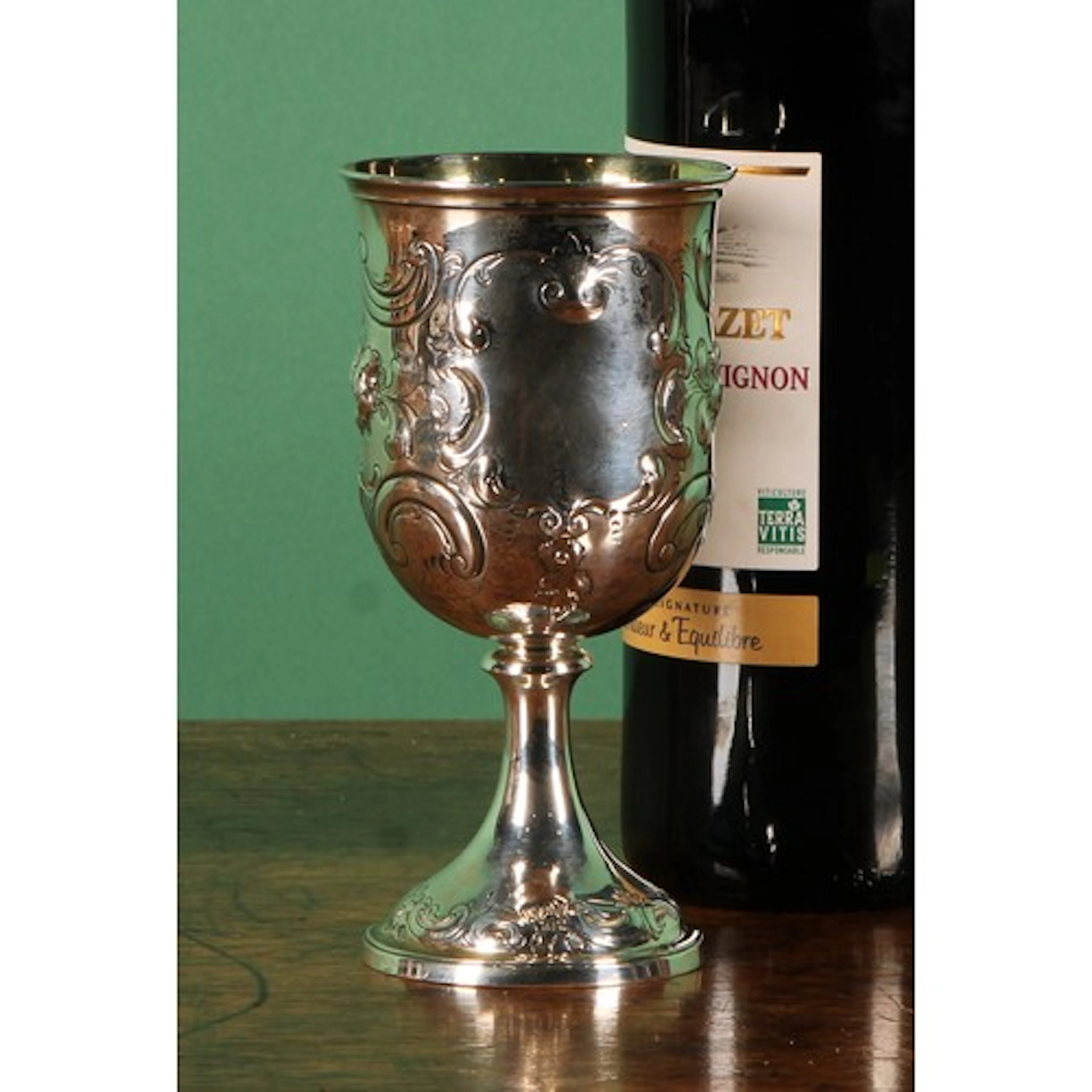 A Victorian silver bell shaped pedestal goblet, embossed wit...