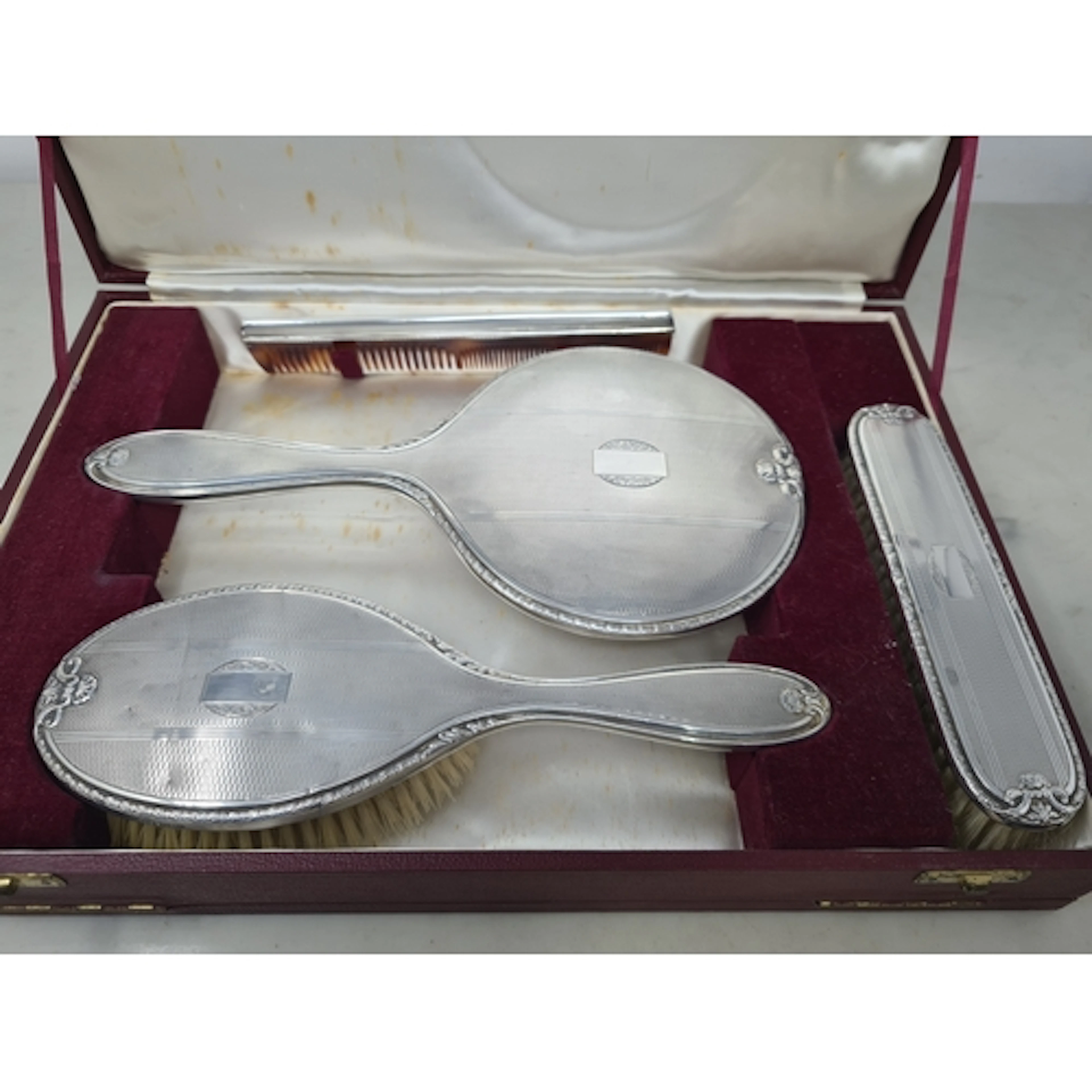 An Elizabeth II silver mounted Dressing Table Set with engin...