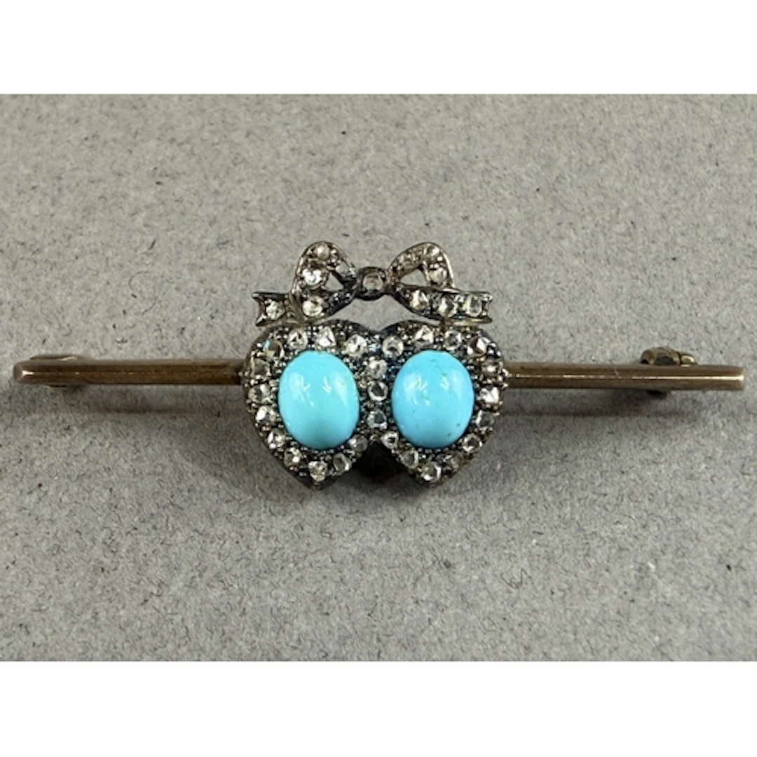 Jewellery: an early 20th century yellow metal bar brooch, un...