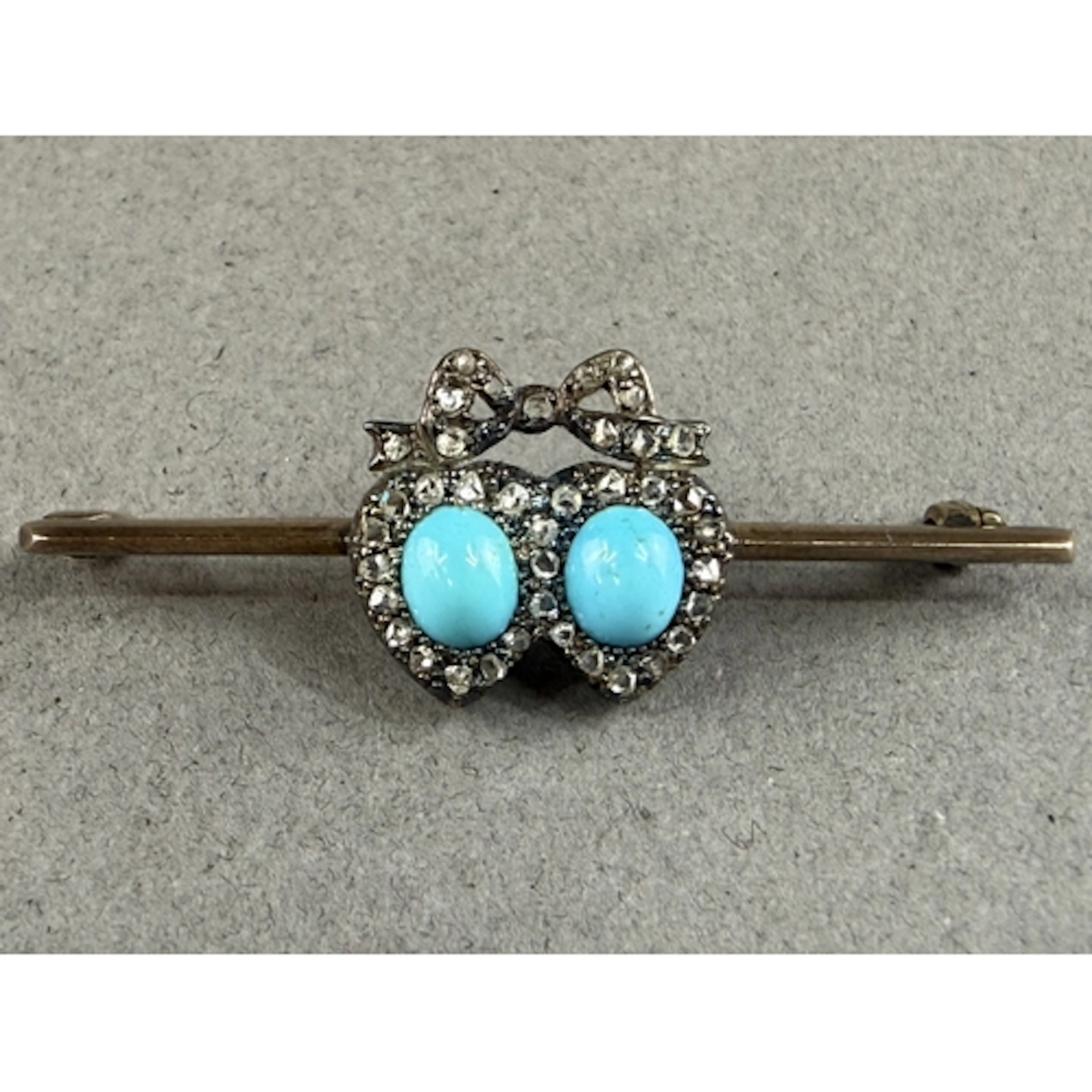 Jewellery: an early 20th century yellow metal bar brooch, un...