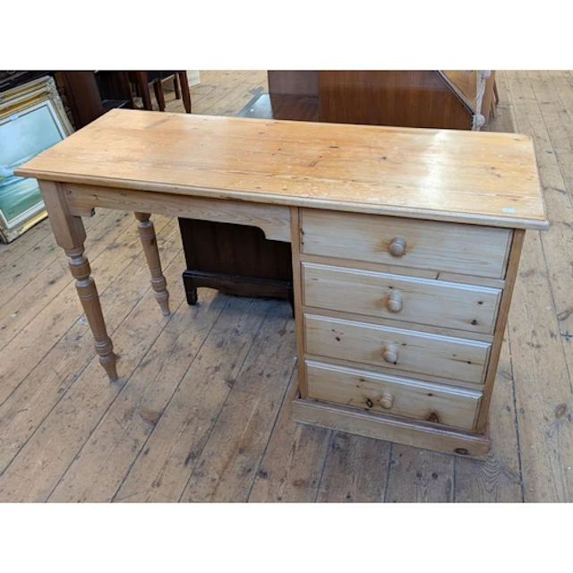 A single pedestal desk fitted four drawers, 4' wide