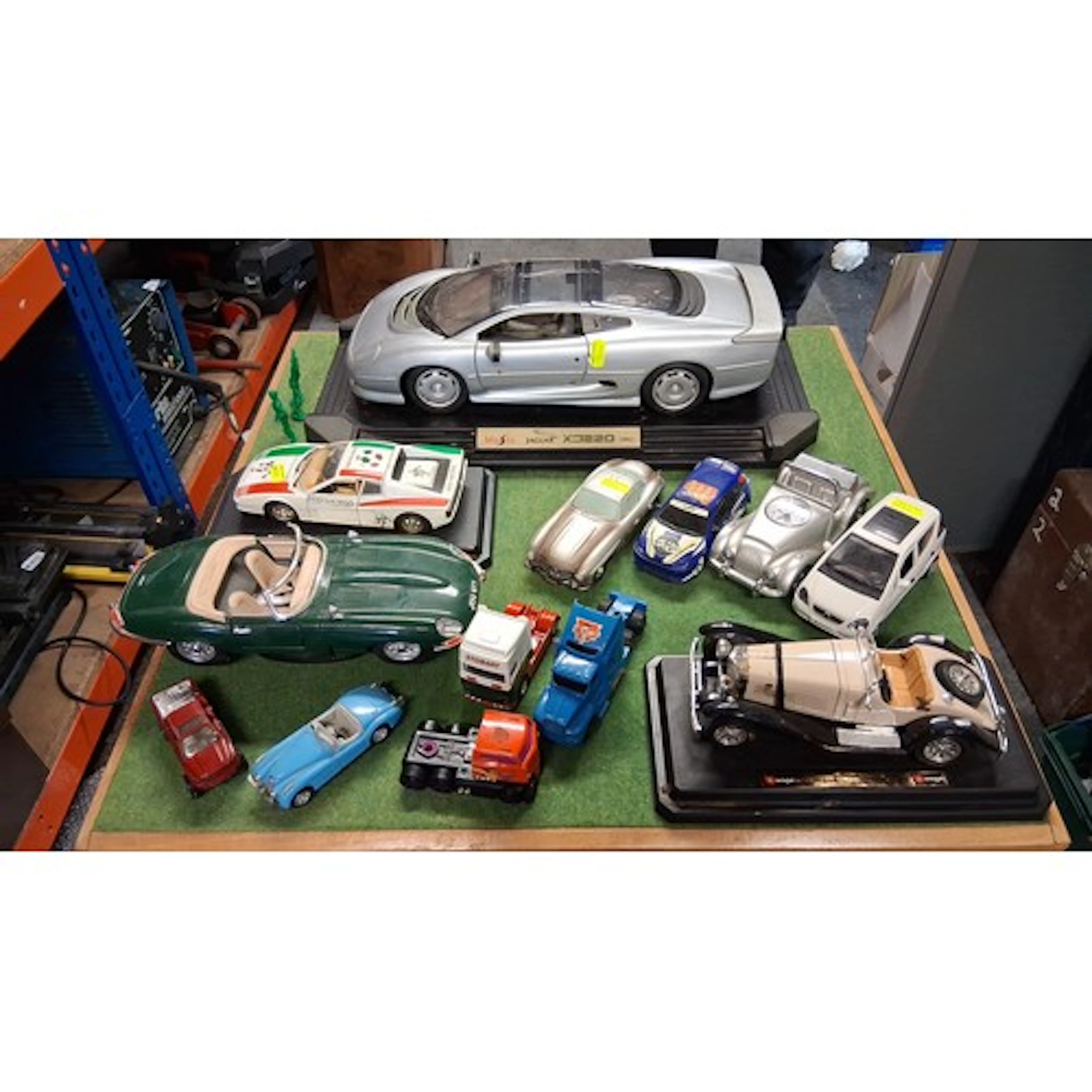 A collection of model and toy vehicles, including Maisto Jag...