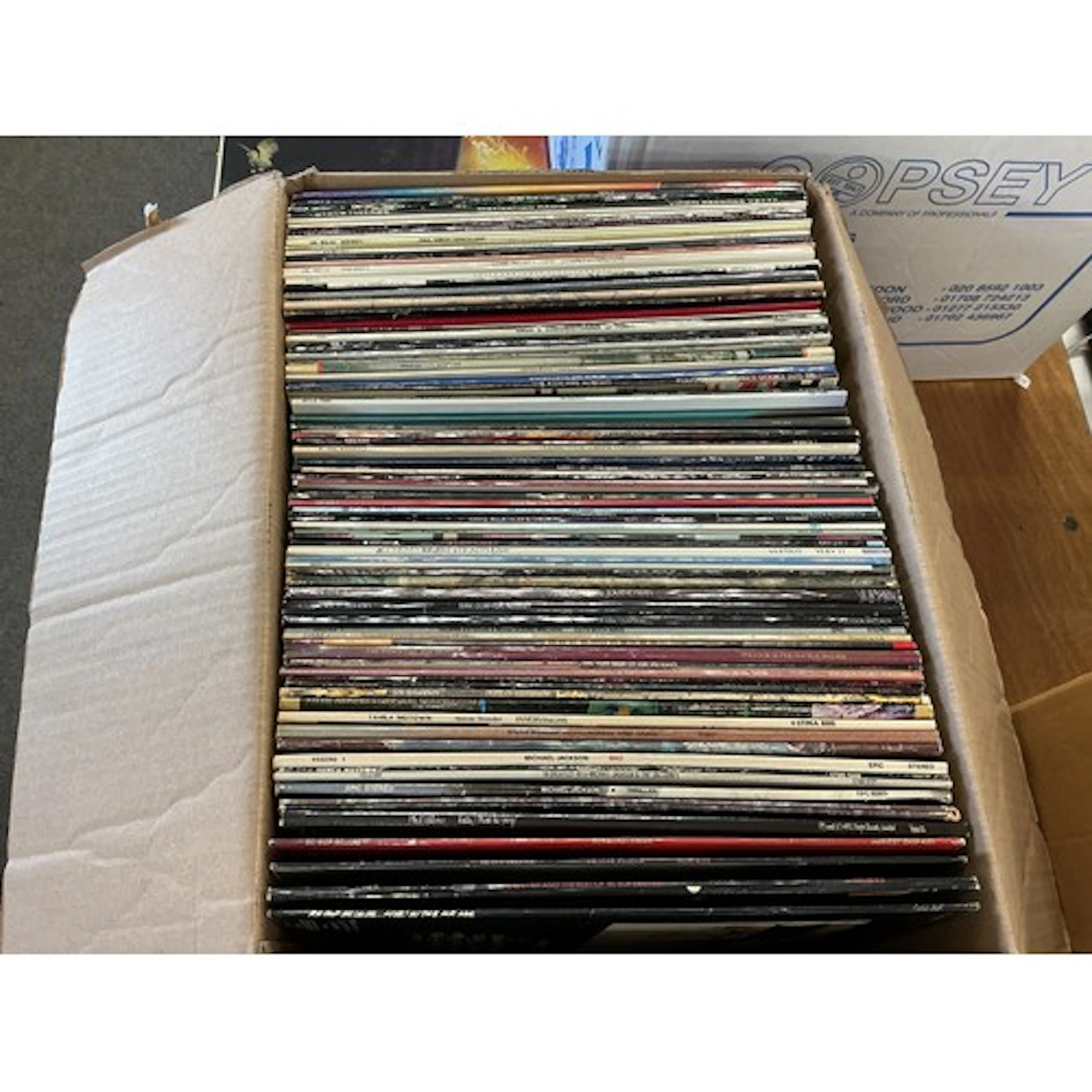 A collection of LPs by various artists including The Who, Ji...