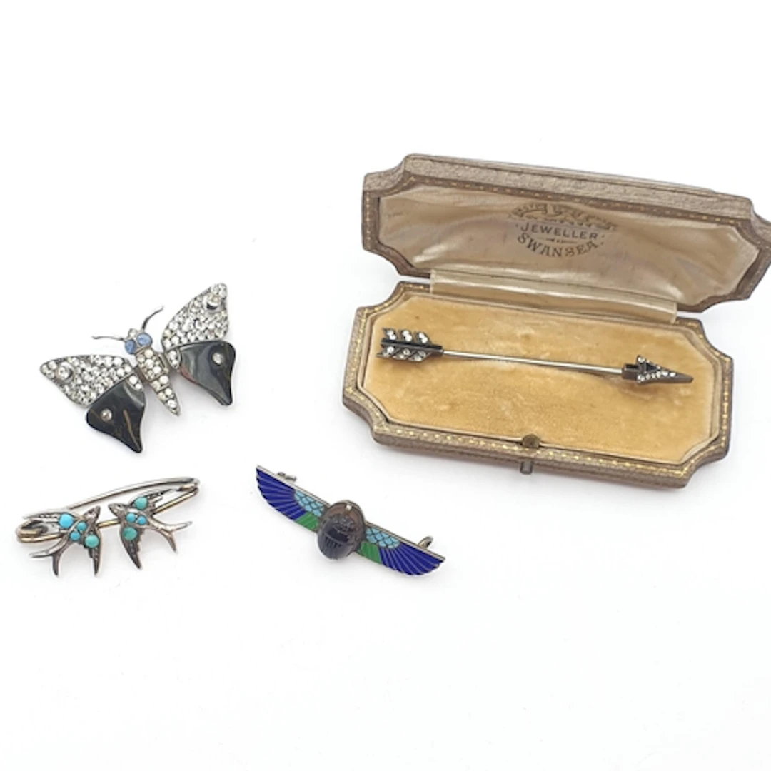 A Knoll & Pregiser Jabot Pin set paste in a fitted case, an ...