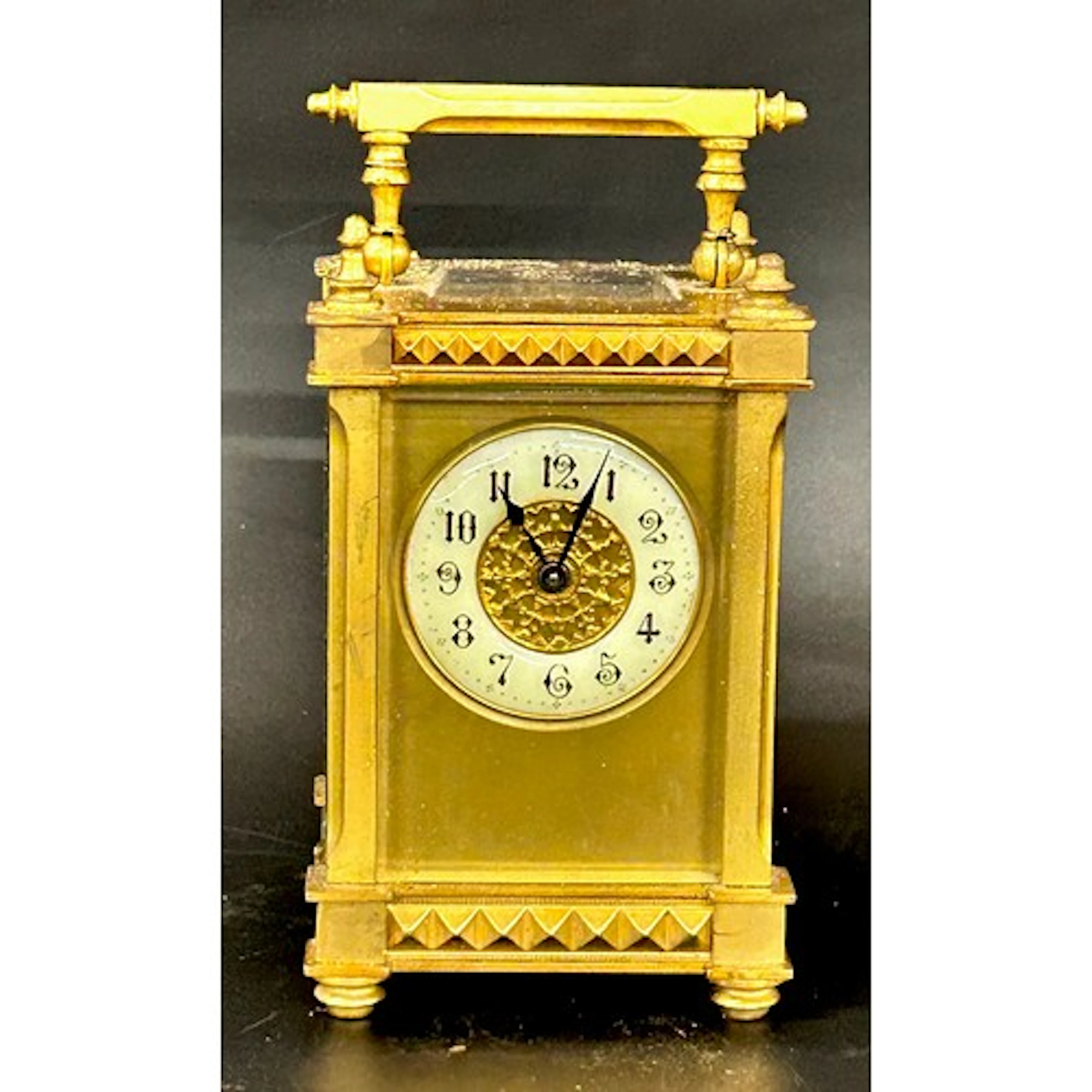 An early 20th Century brass carriage clock with enamel front...