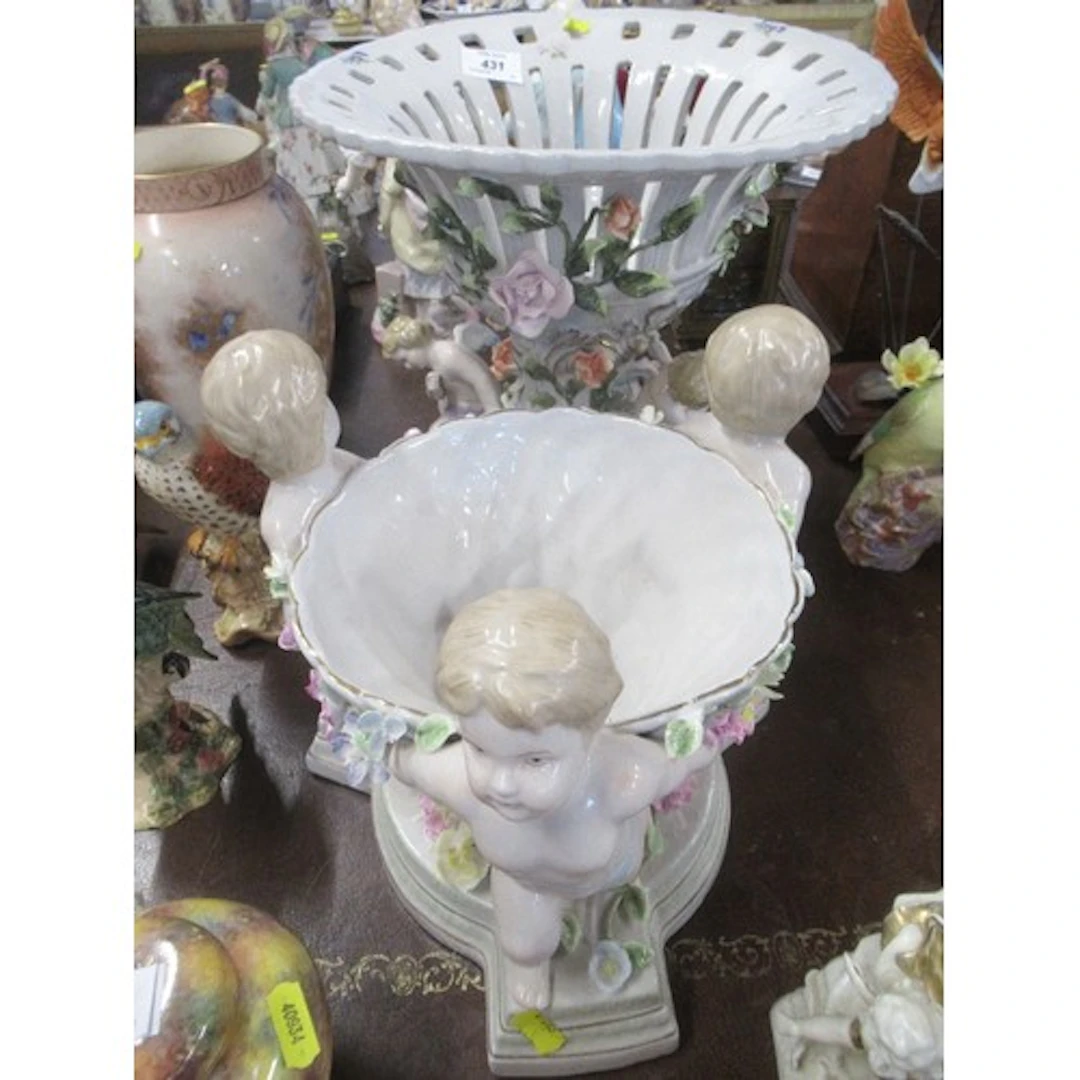 Two Continental centre pieces, decorated with flowers and ch...