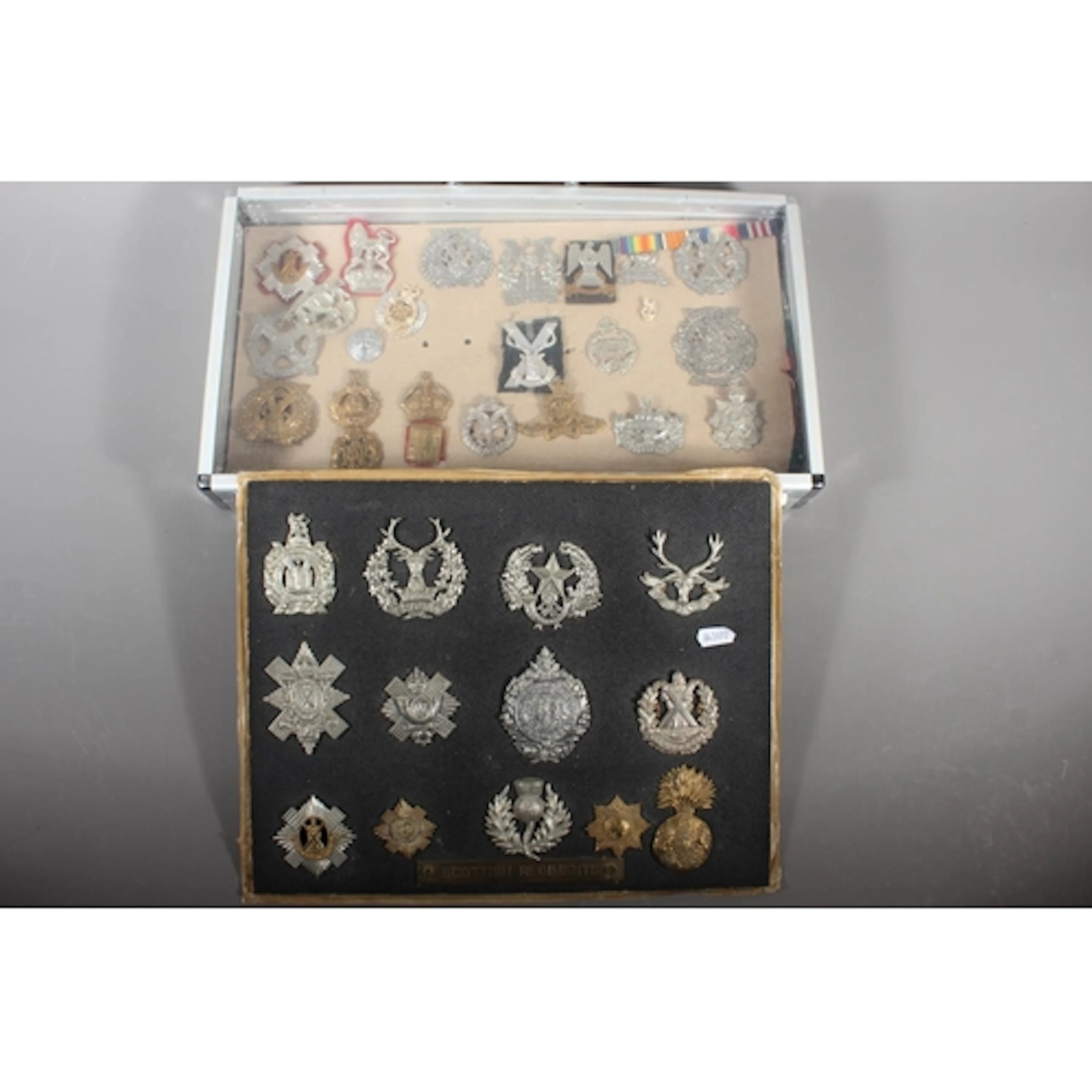 Military cap badges to include Seaforth Highlanders, Cameron...