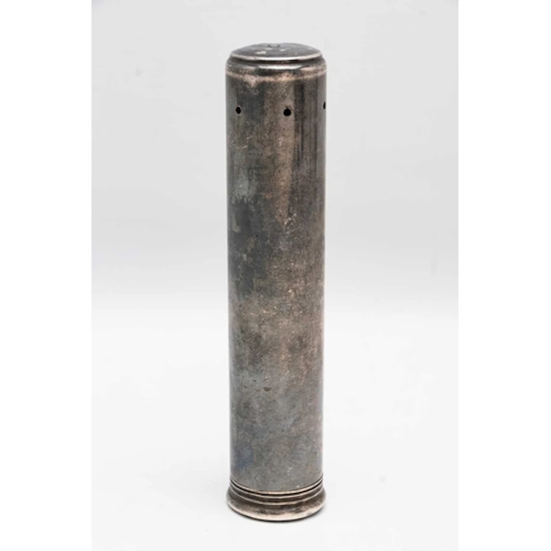 A WHITE METAL TUBE, signed 'Finnigans Manchester' to the bas...