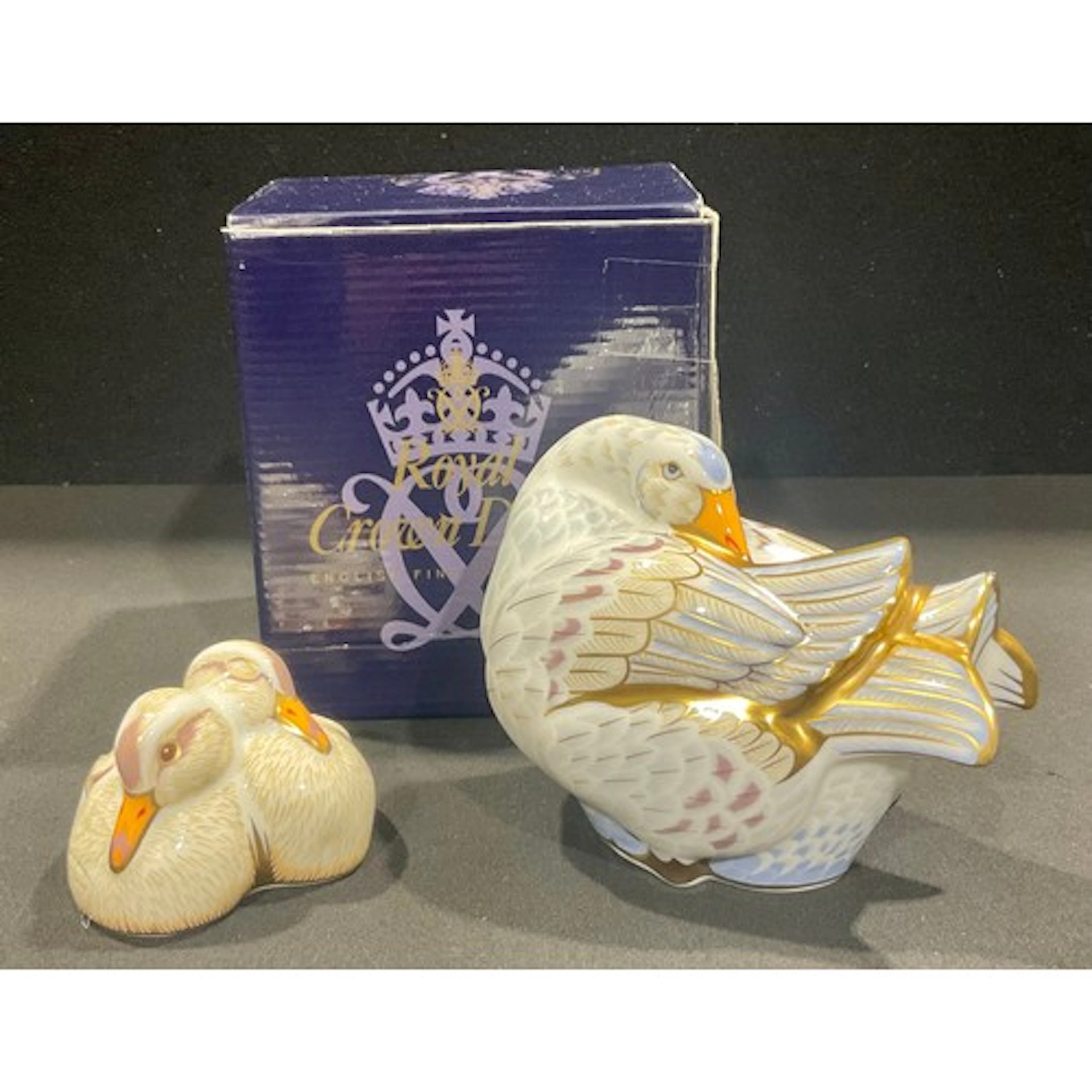 A Royal Crown Derby paperweight family group, Designers' Cho...