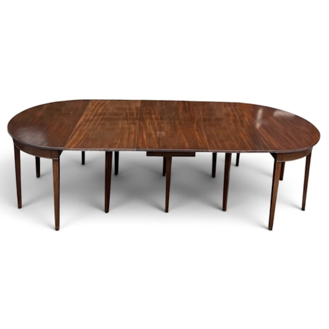 A MAHOGANY GATE-LEG DINING TABLE WITH TWO ADDITIONAL LEAVES ...