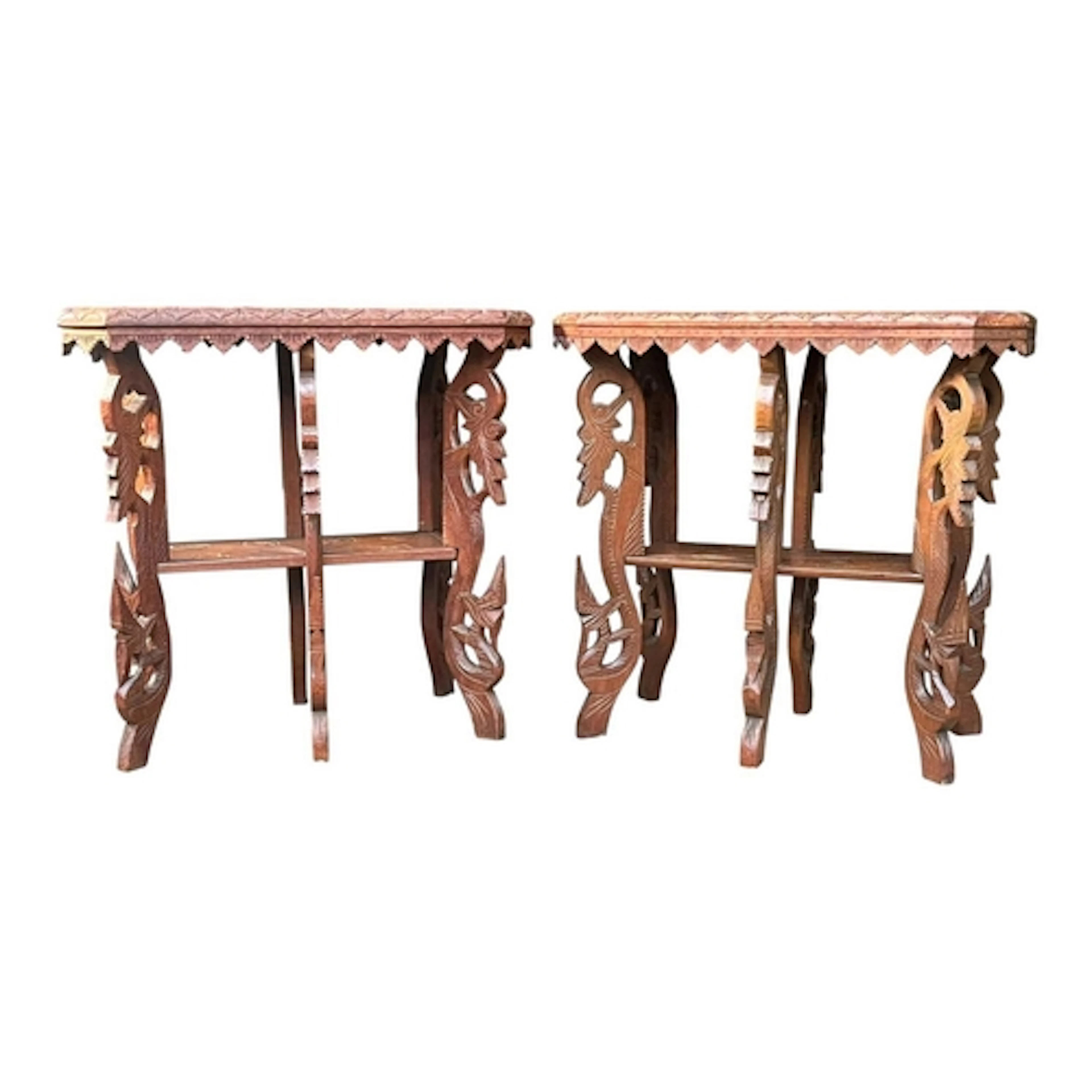 A pair of Anglo colonial Burmese hardwood carved side tables...