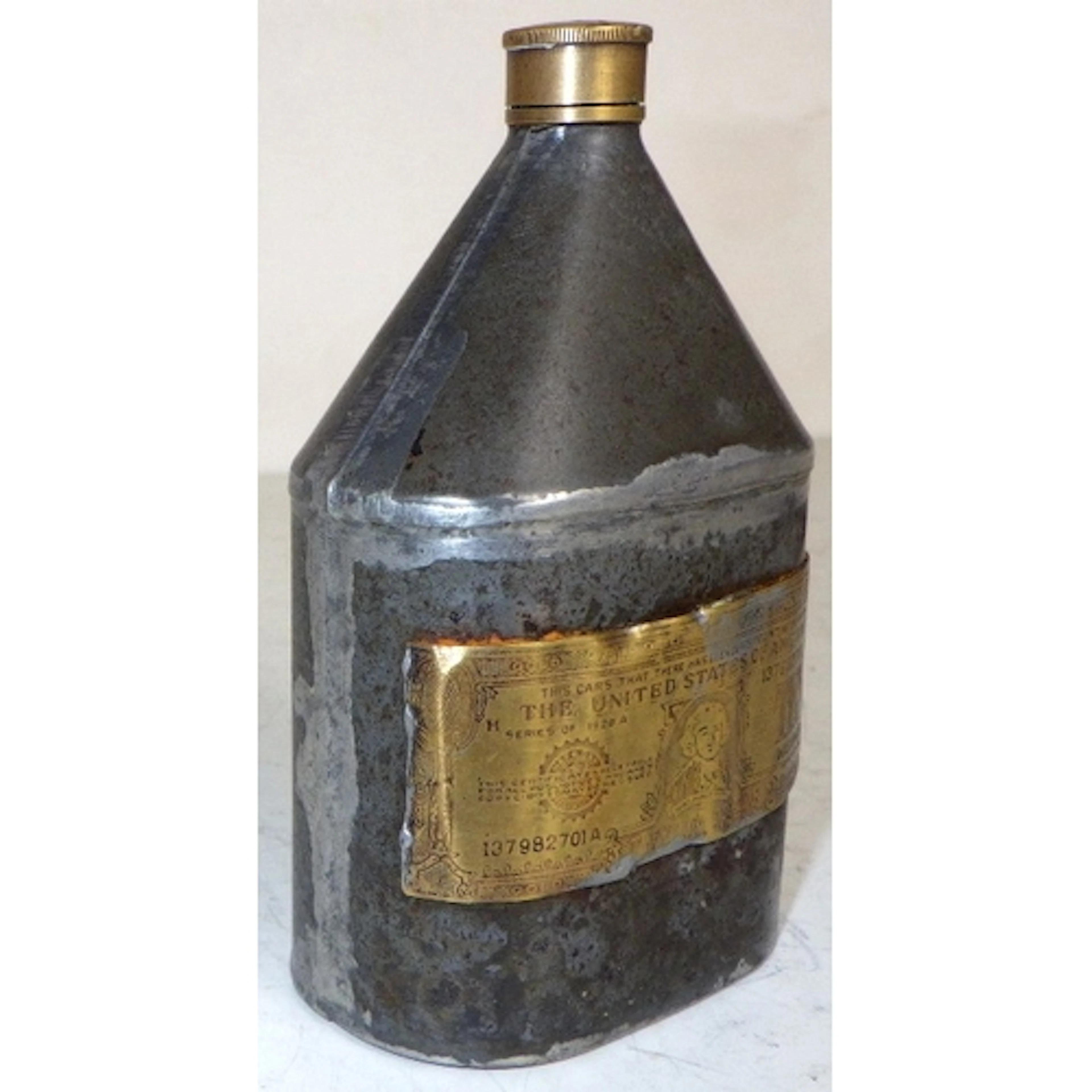 A USA interest oil ? tin bottle, 11cm tall