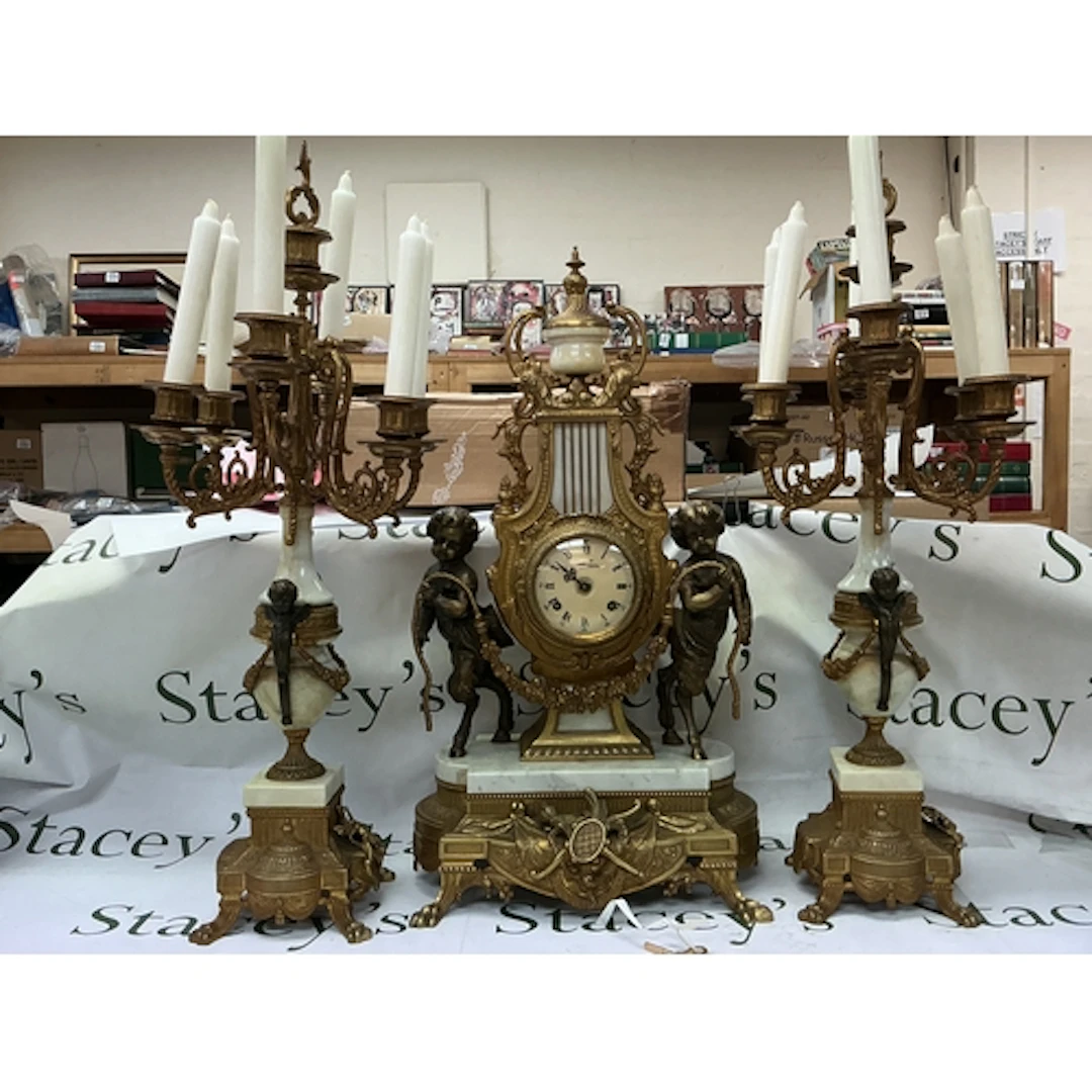 An Italian style gilt bronze and marble mantel clock and can...