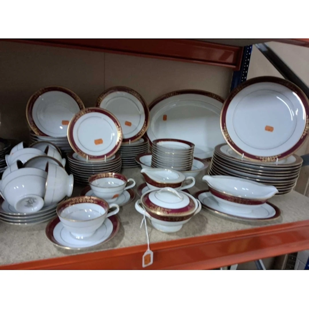 A NORITAKE 'GOLDMERE' DINNER SERVICE comprising a large serv...