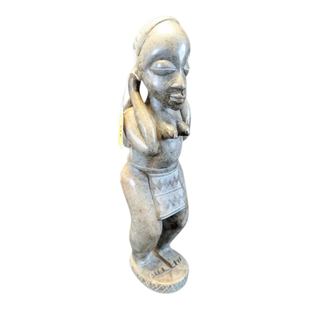 A 20th century signed African Gabonese mbigou stone tribal s...