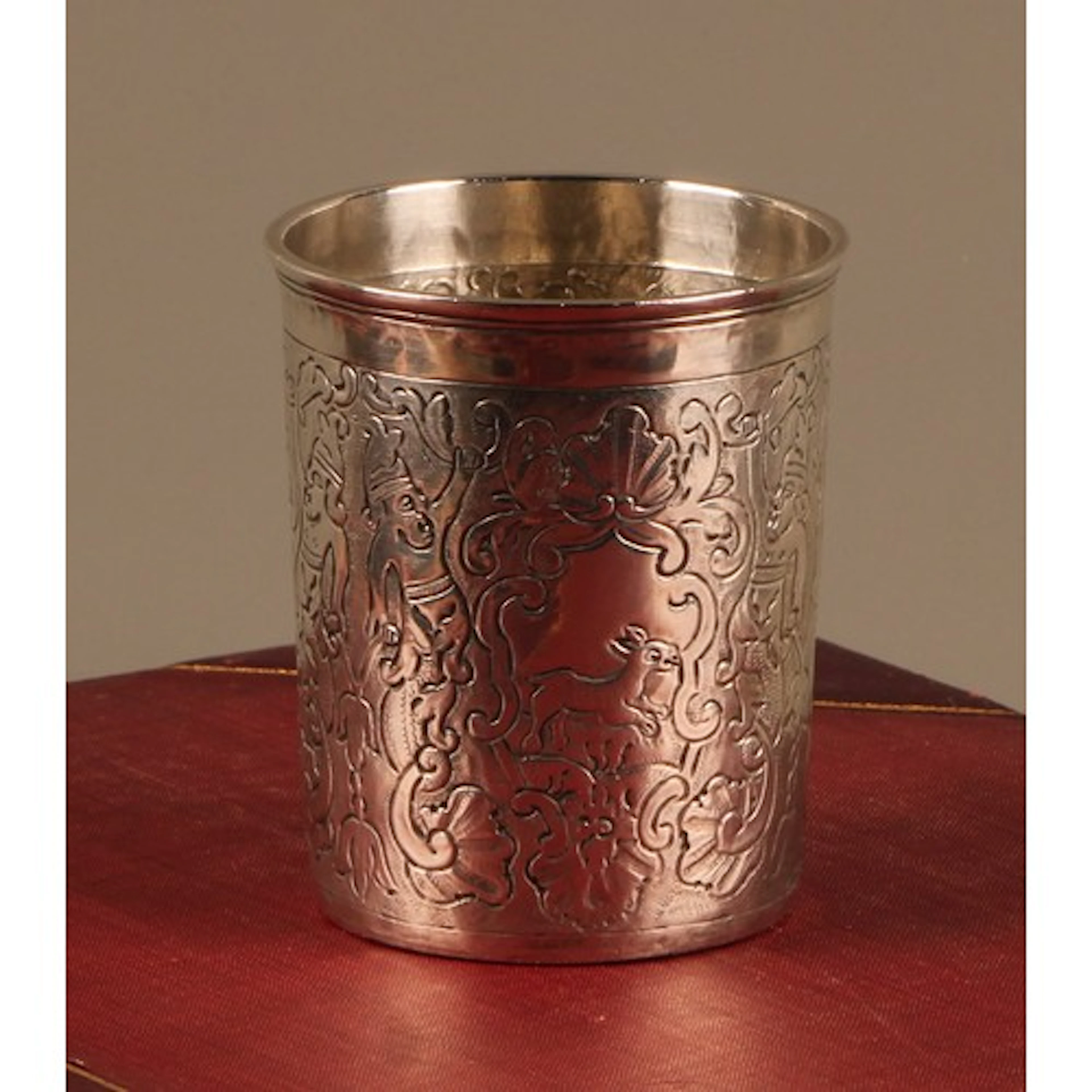 An 18th century Russian silver beaker, chased with an eagle,...
