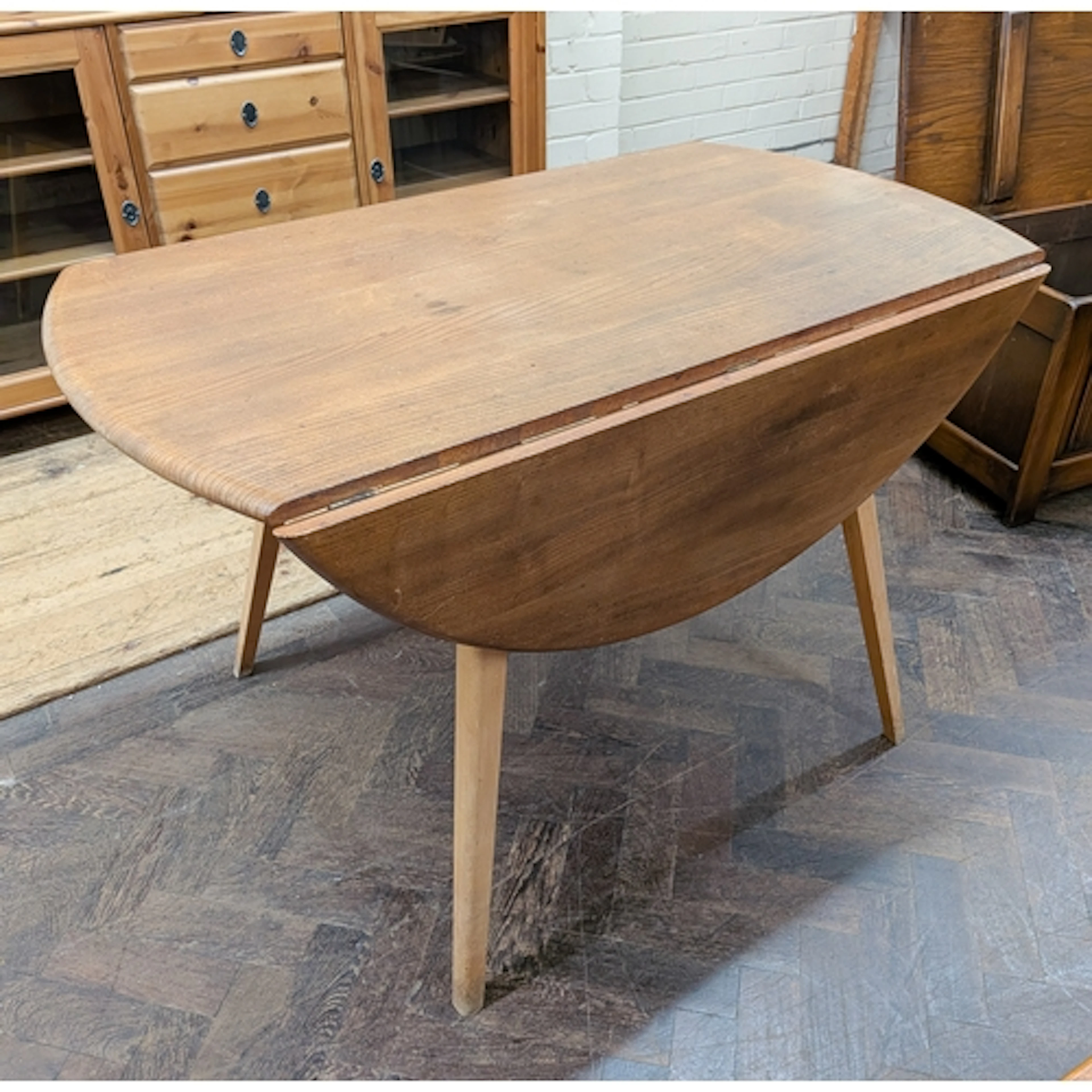 Ercol - a vintage Windsor drop leaf dining table 44.5" acros...