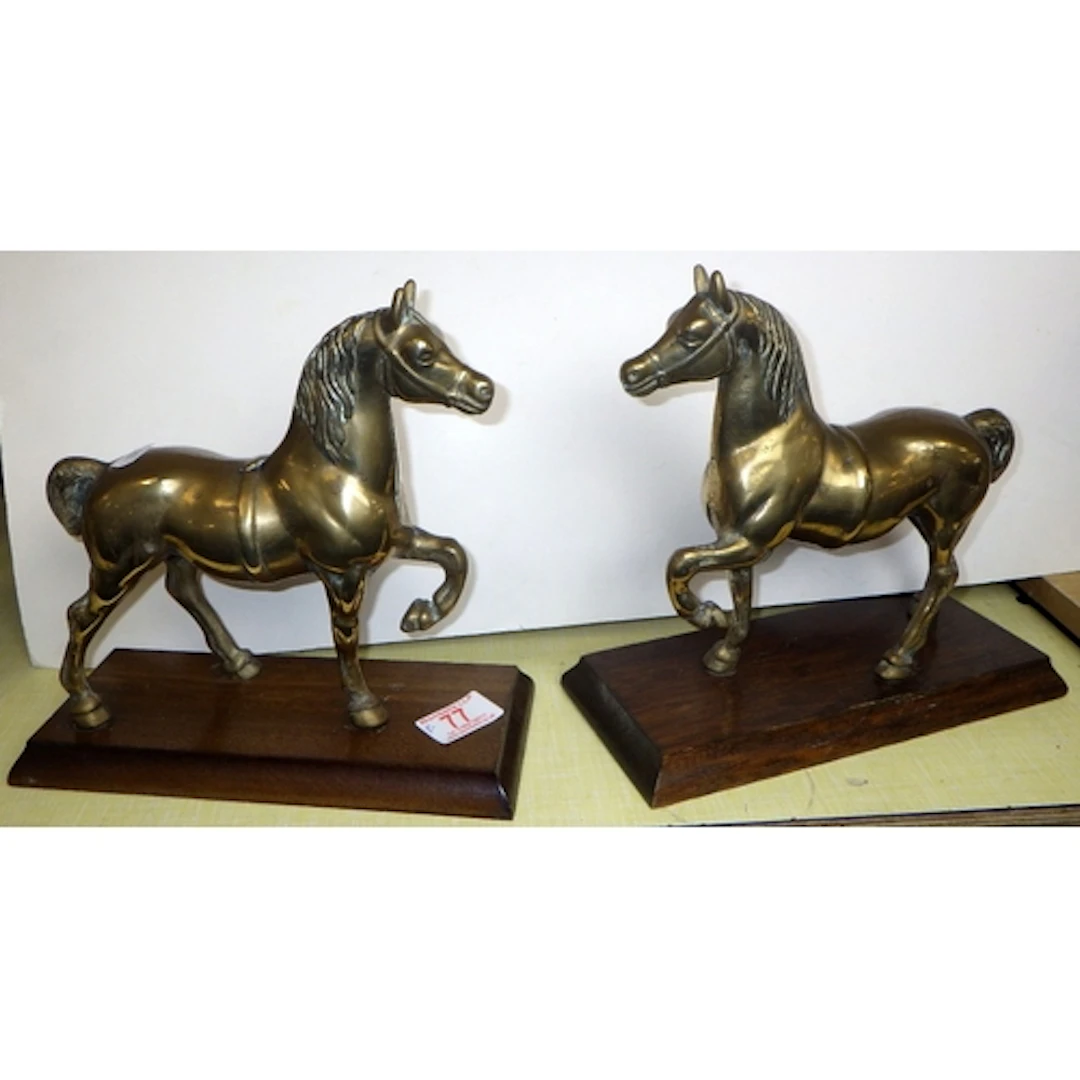 A pair of brass horse figures