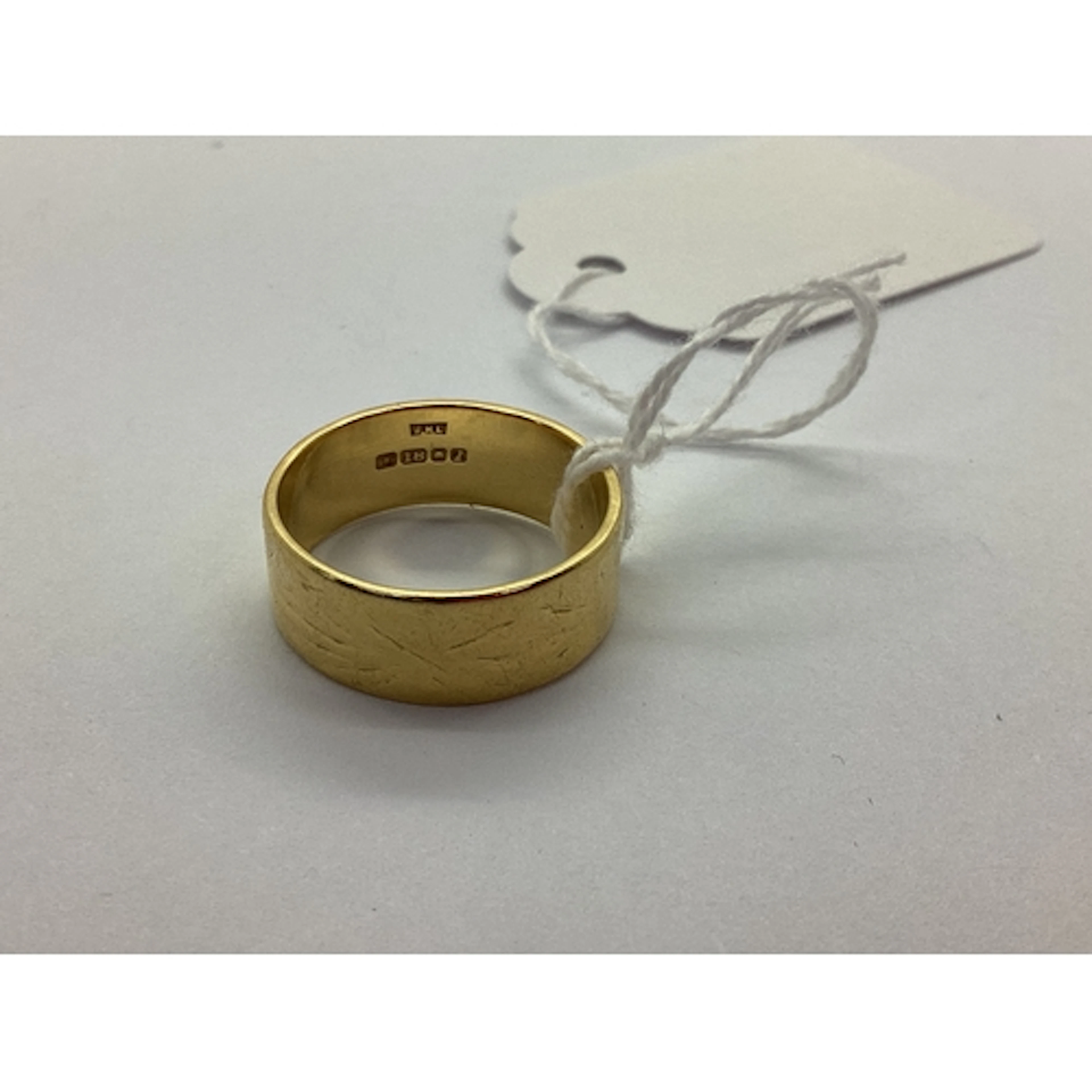 An 18ct Gold Wide Wedding Band, patterned (worn) (finger siz...