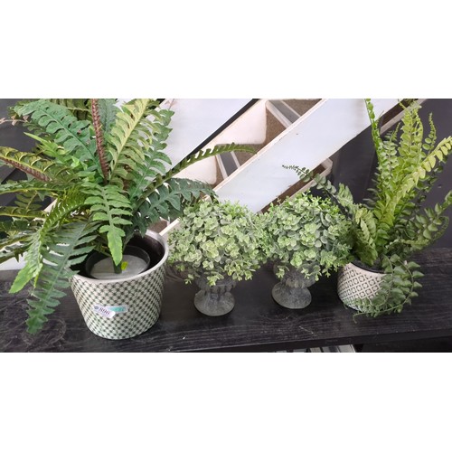A group of artificial foliage arrangements, including fern a...