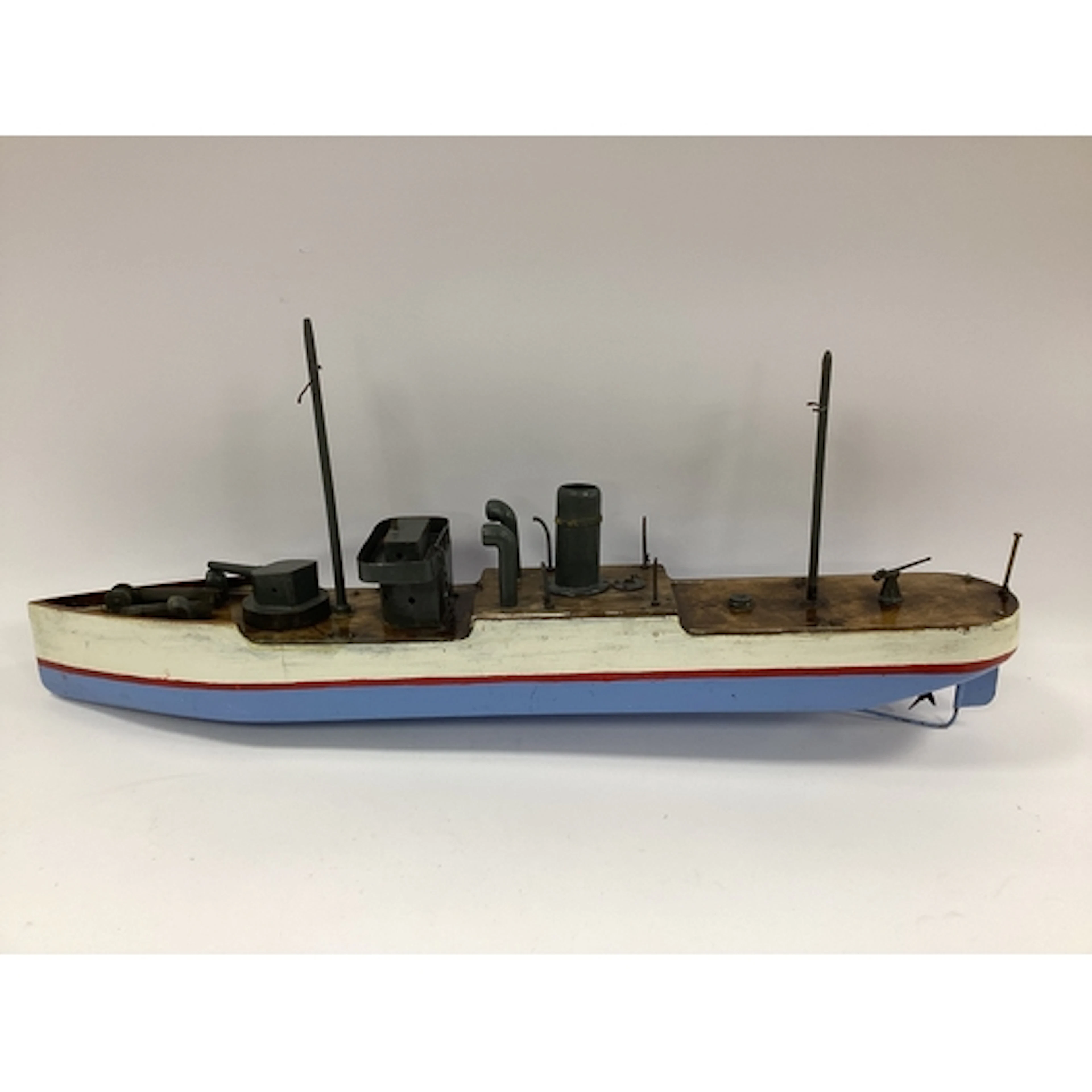 A mid XX century homemade clockwork toy boat of a World War ...
