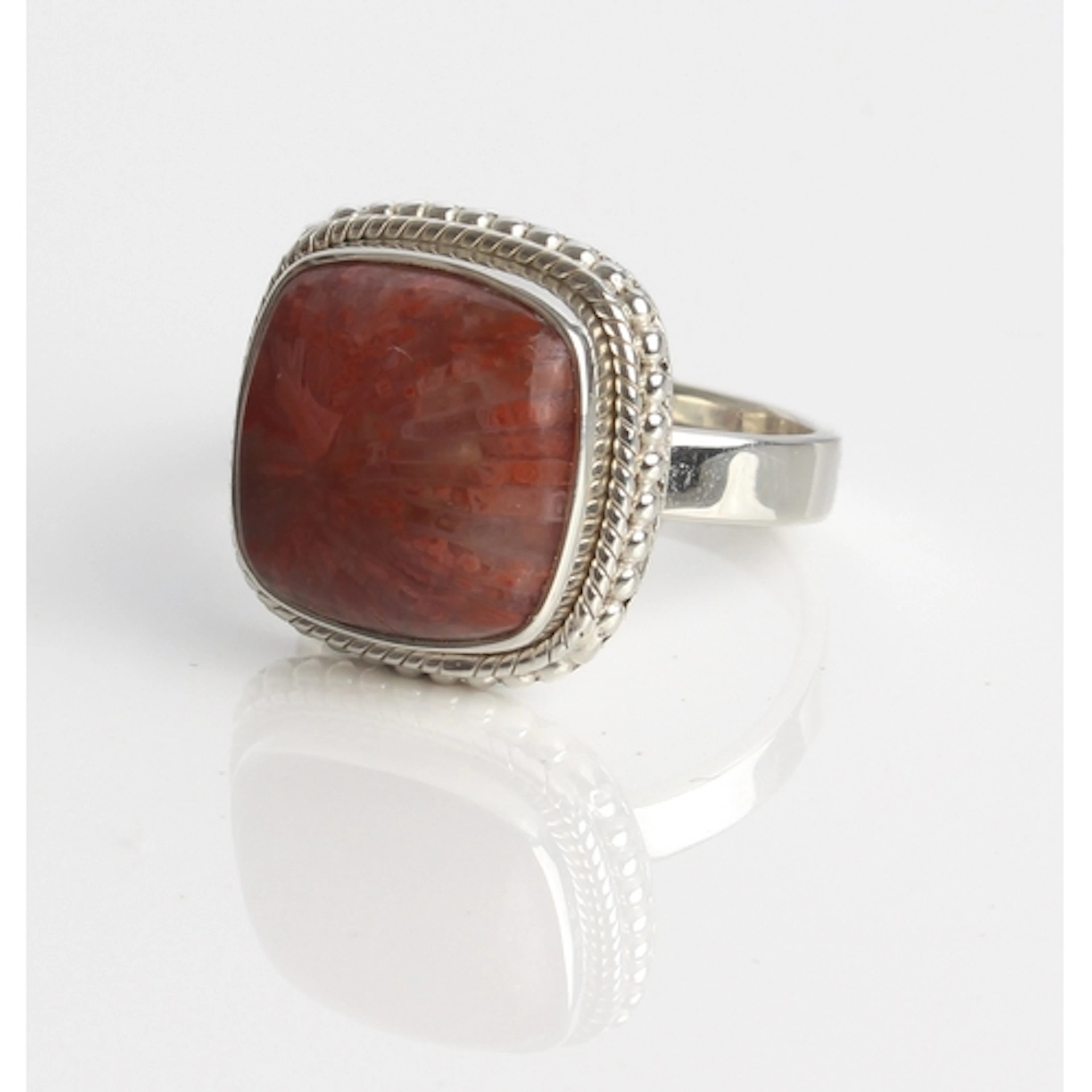 A Fossil red coral and sterling silver ring - with a 10ct sq...