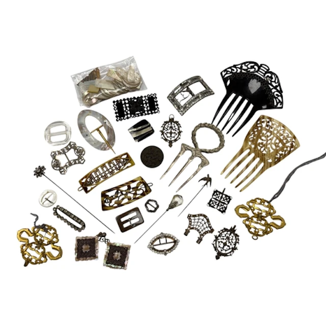 A group of assorted shoe buckles and hair ornaments and a qu...